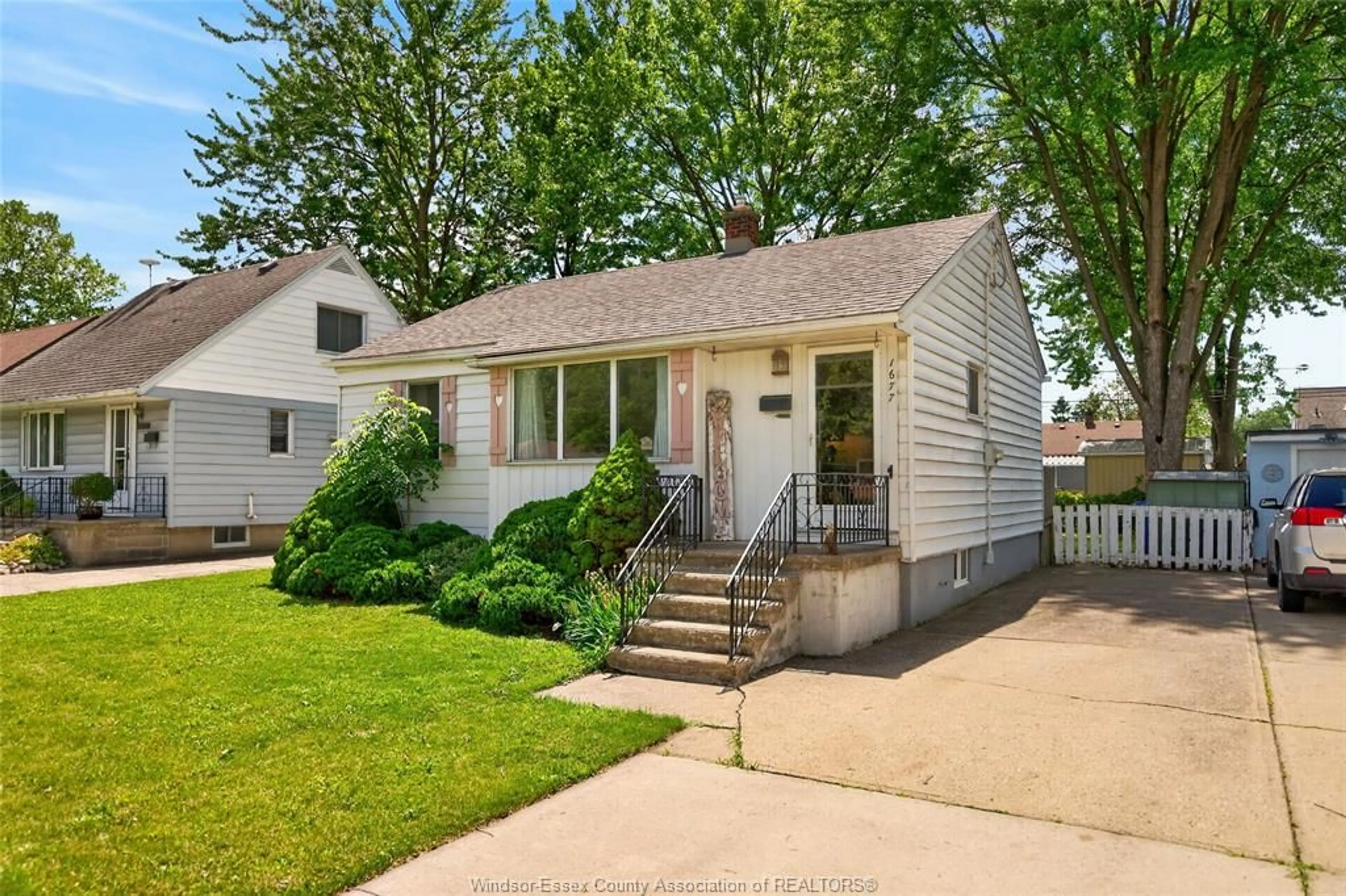 Home with vinyl exterior material, street for 1677 Norman Rd, Windsor Ontario N8Y 4N6