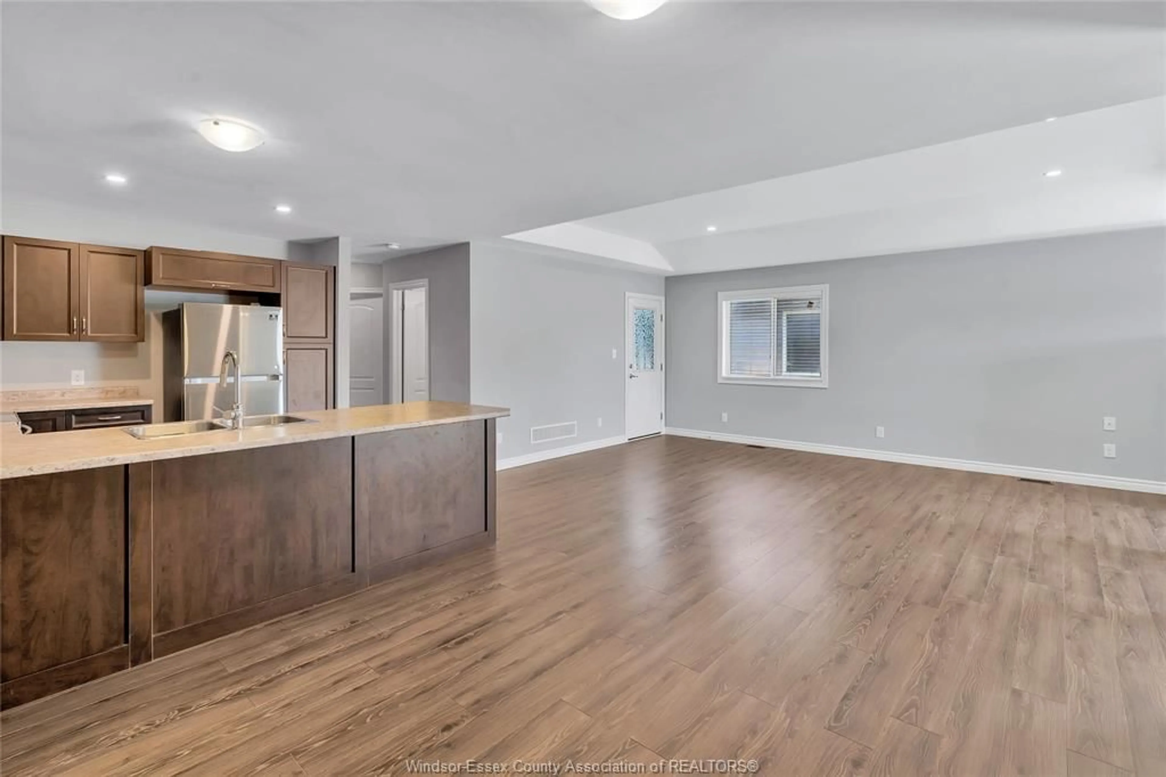 Open concept kitchen, wood/laminate floor for 3141 VIOLA Cres, Windsor Ontario N8N 0A2