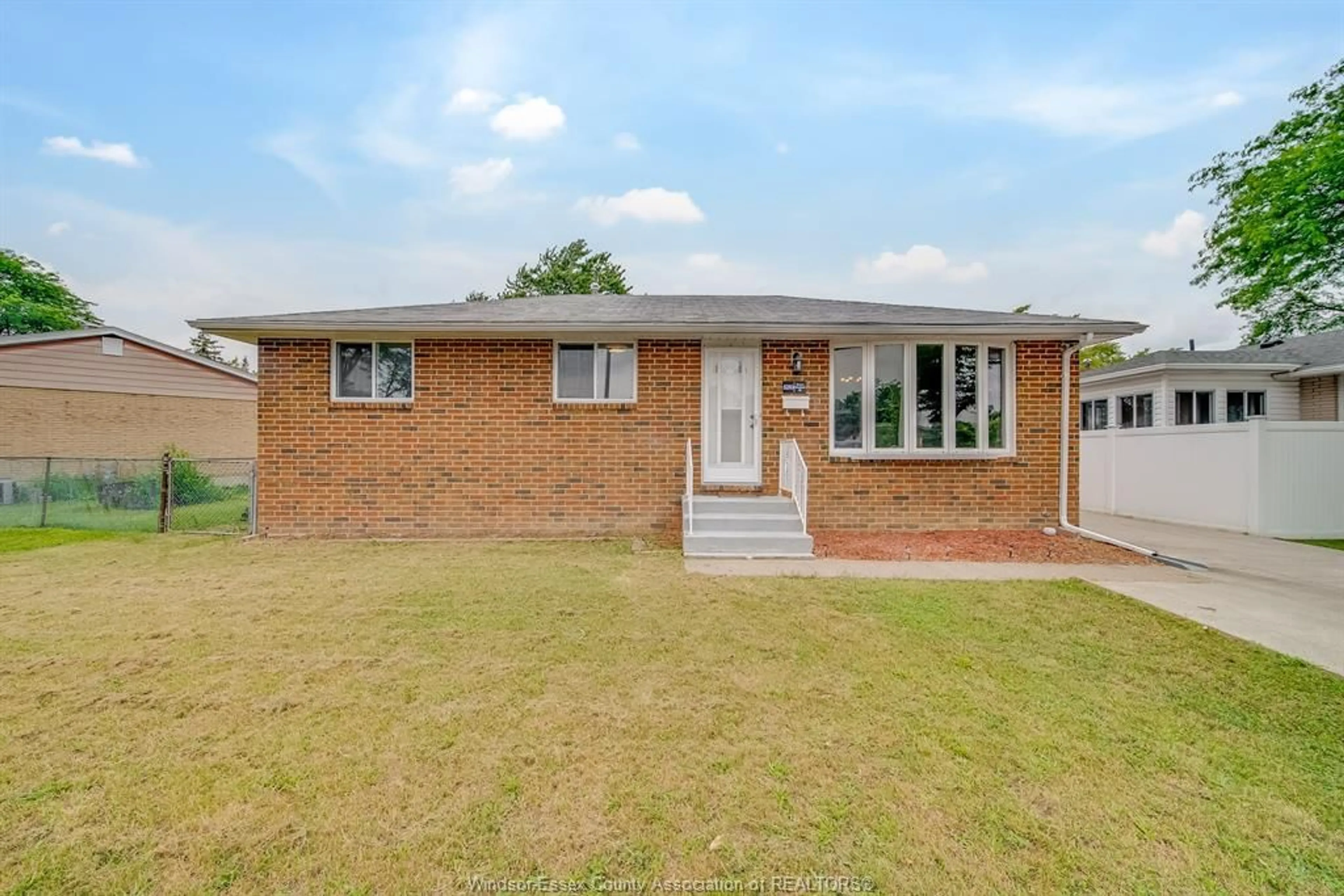 Home with brick exterior material, street for 5210 QUEEN ELIZABETH Dr, Windsor Ontario N8T 1N3