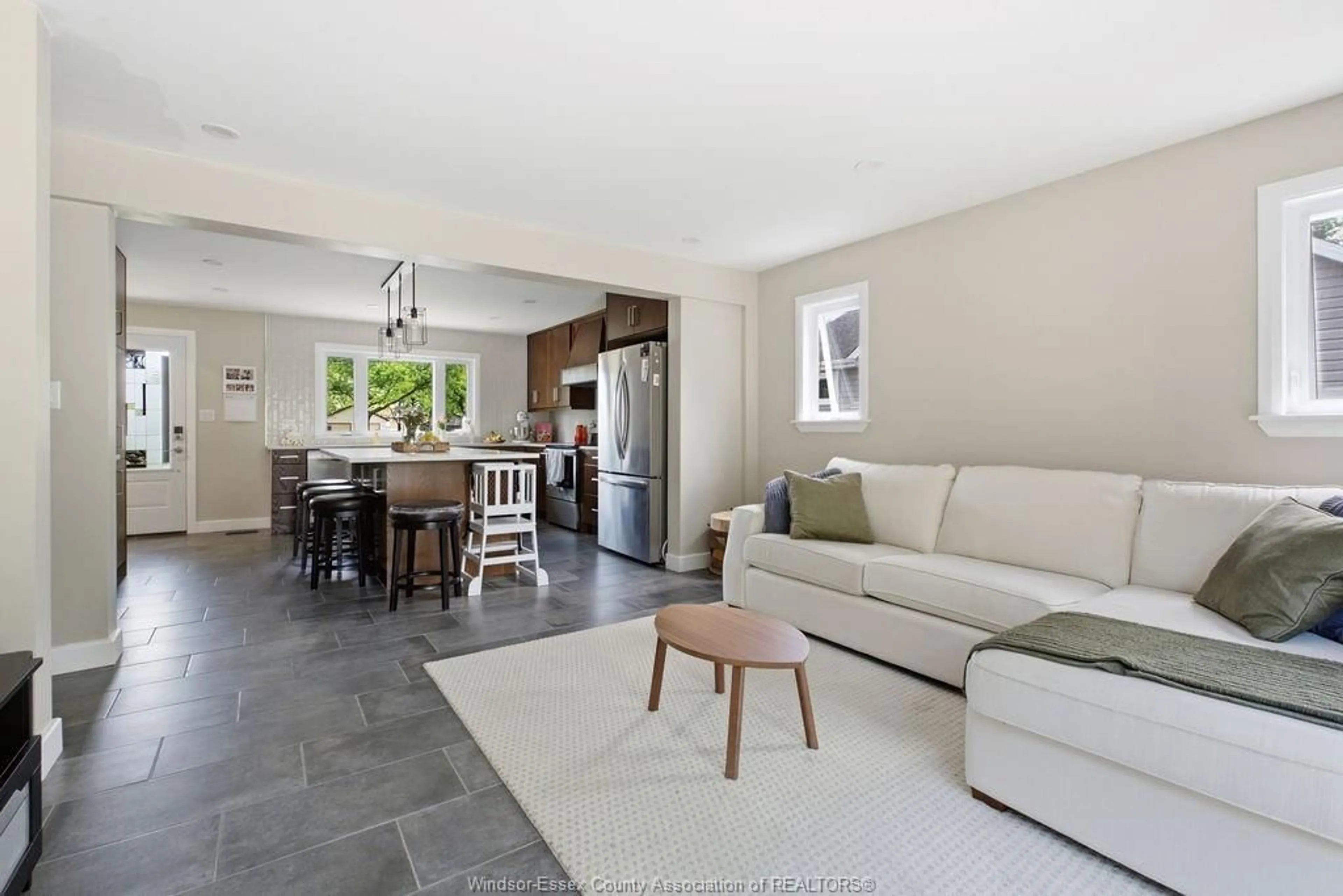 Living room with furniture, ceramic/tile floor for 1305 SHAWNEE Rd, Tecumseh Ontario N8N 1R8