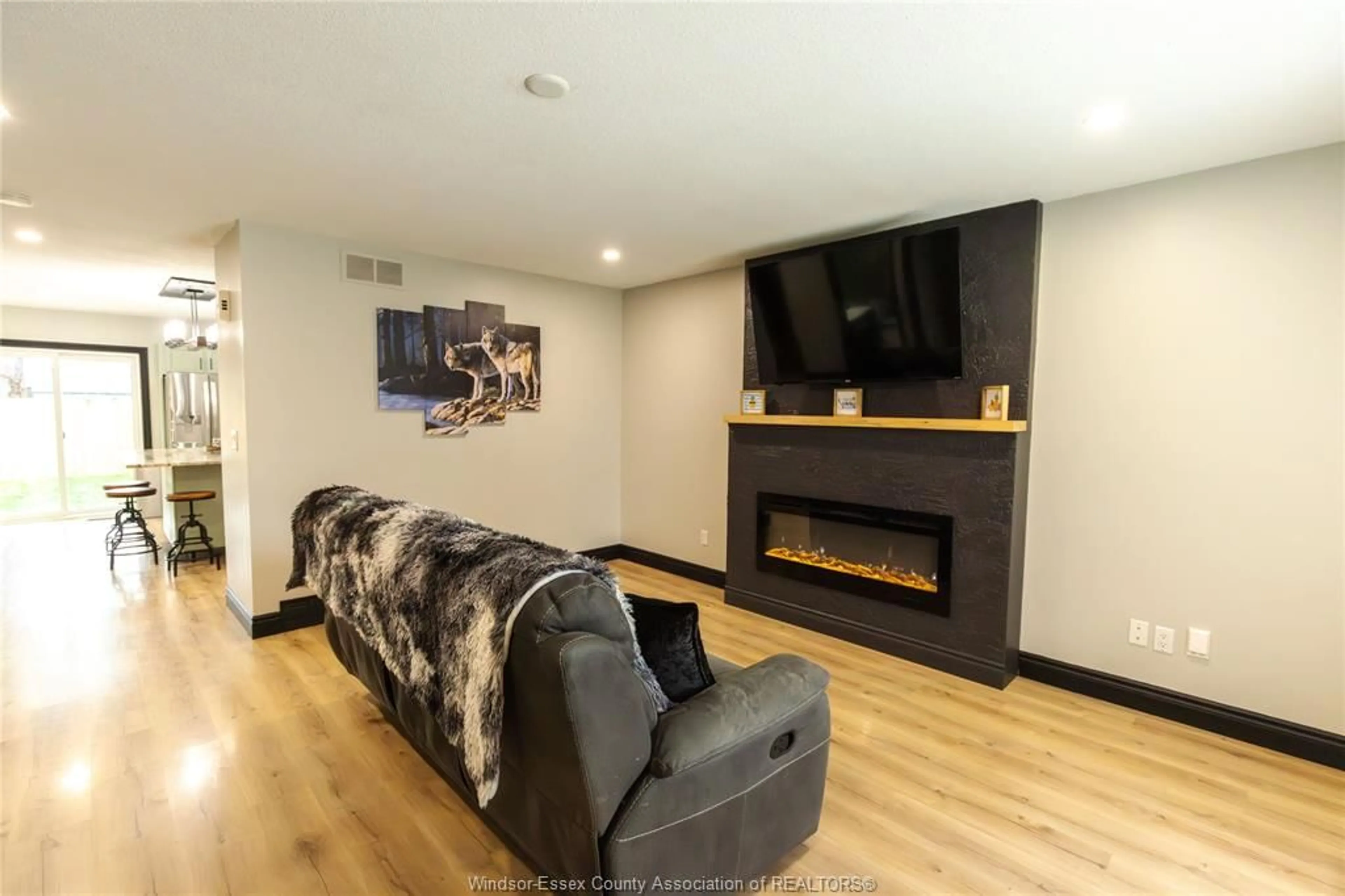 Living room with furniture, wood/laminate floor for 437 ST. LOUIS, Belle River Ontario N0R 1A0