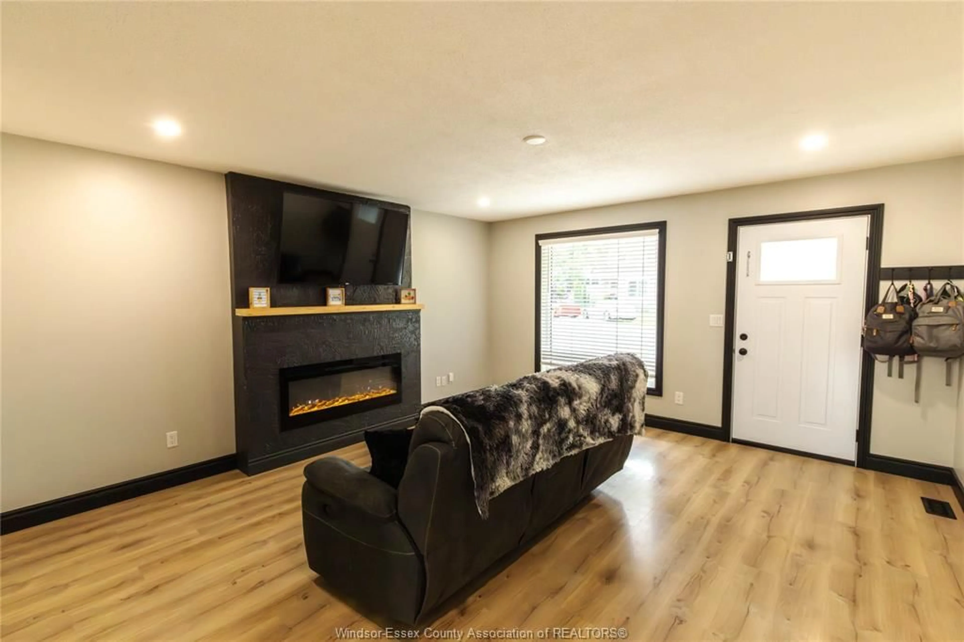 Living room with furniture, wood/laminate floor for 437 ST. LOUIS, Belle River Ontario N0R 1A0