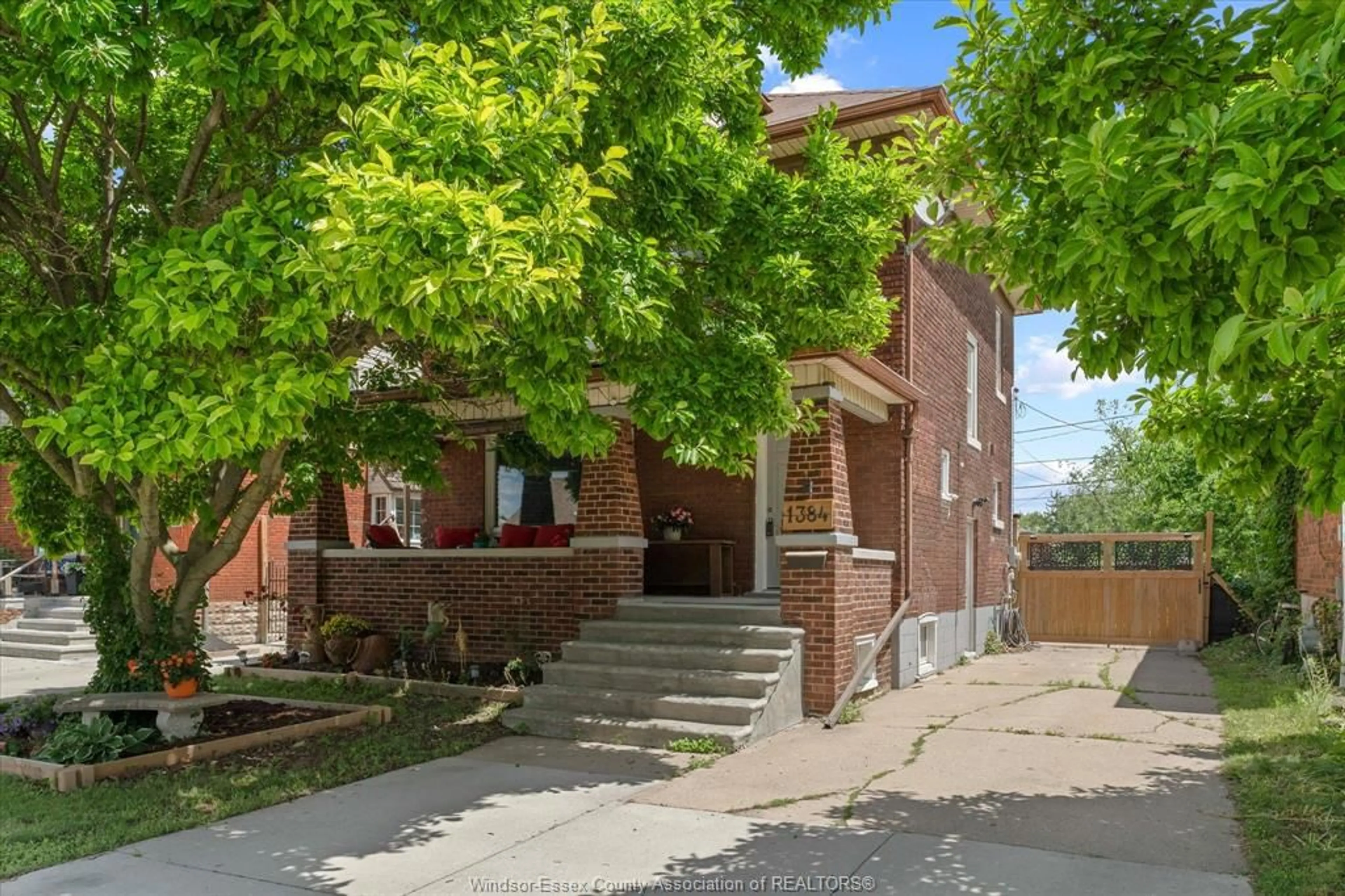 Home with brick exterior material, street for 1384 PILLETTE Rd, Windsor Ontario N8Y 3B9