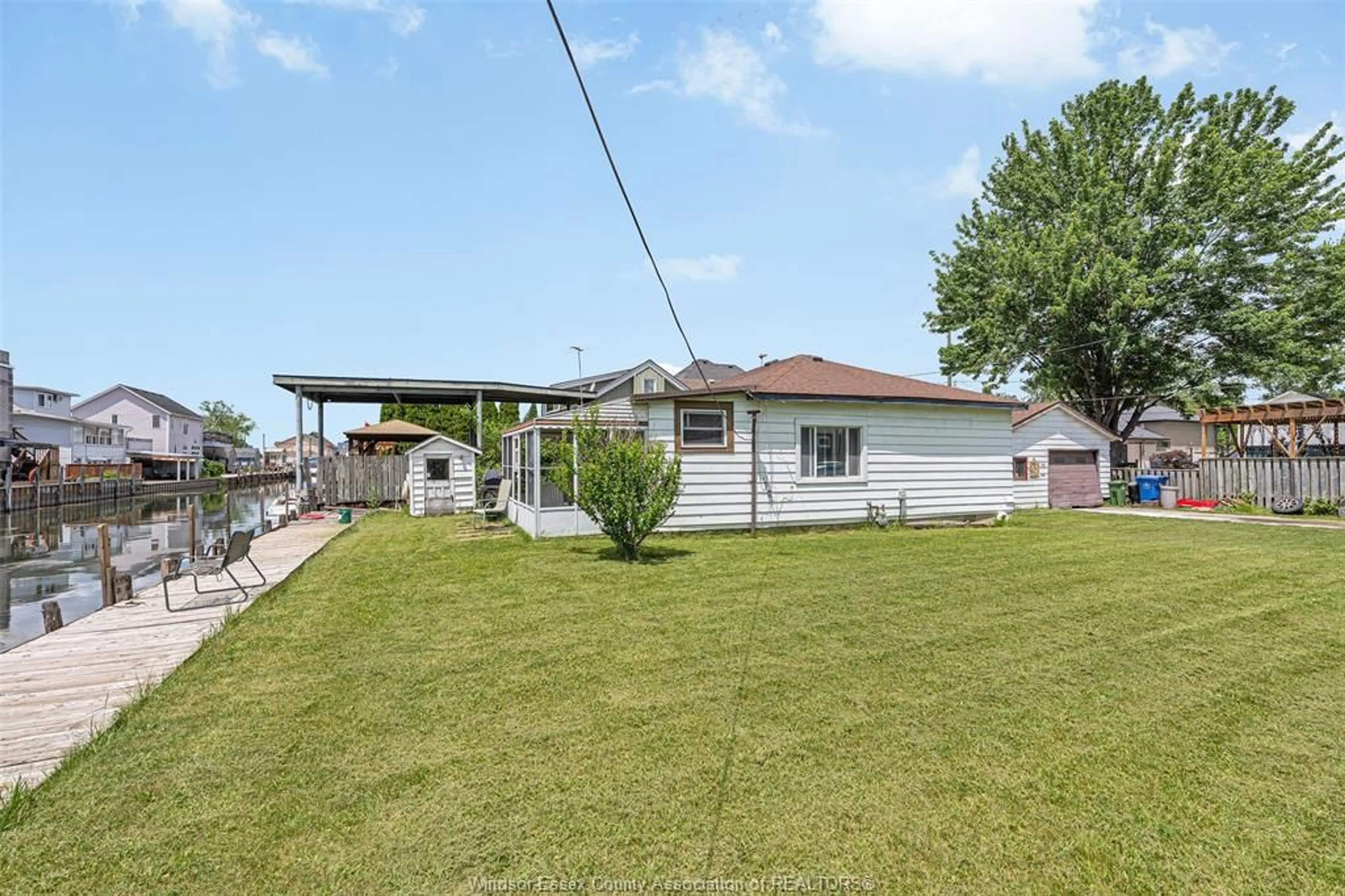 A pic from outside/outdoor area/front of a property/back of a property/a pic from drone, water/lake/river/ocean view for 22 MANHATTAN St, LaSalle Ontario N9J 2L7
