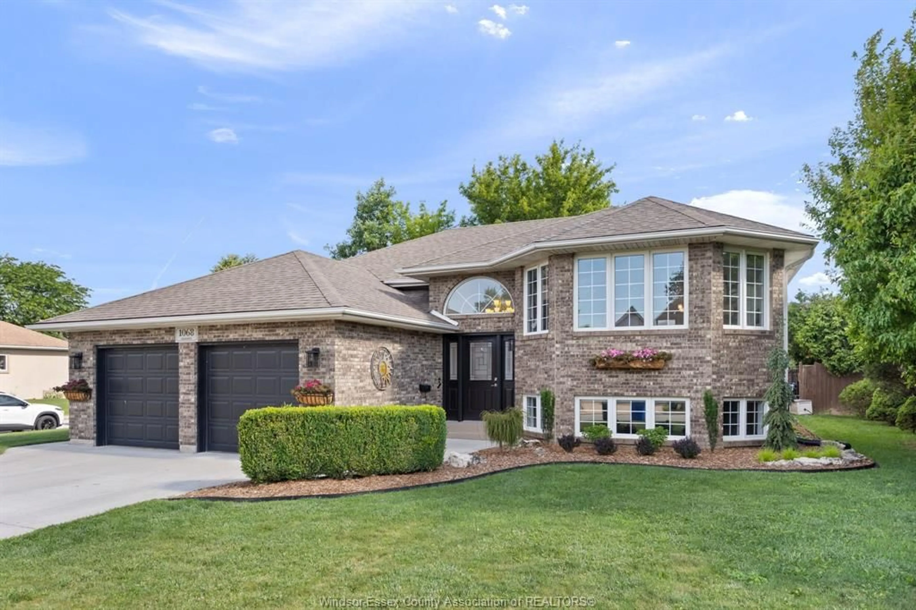 Home with brick exterior material, street for 1068 SOCRATES Cres, Windsor Ontario N9G 2N9