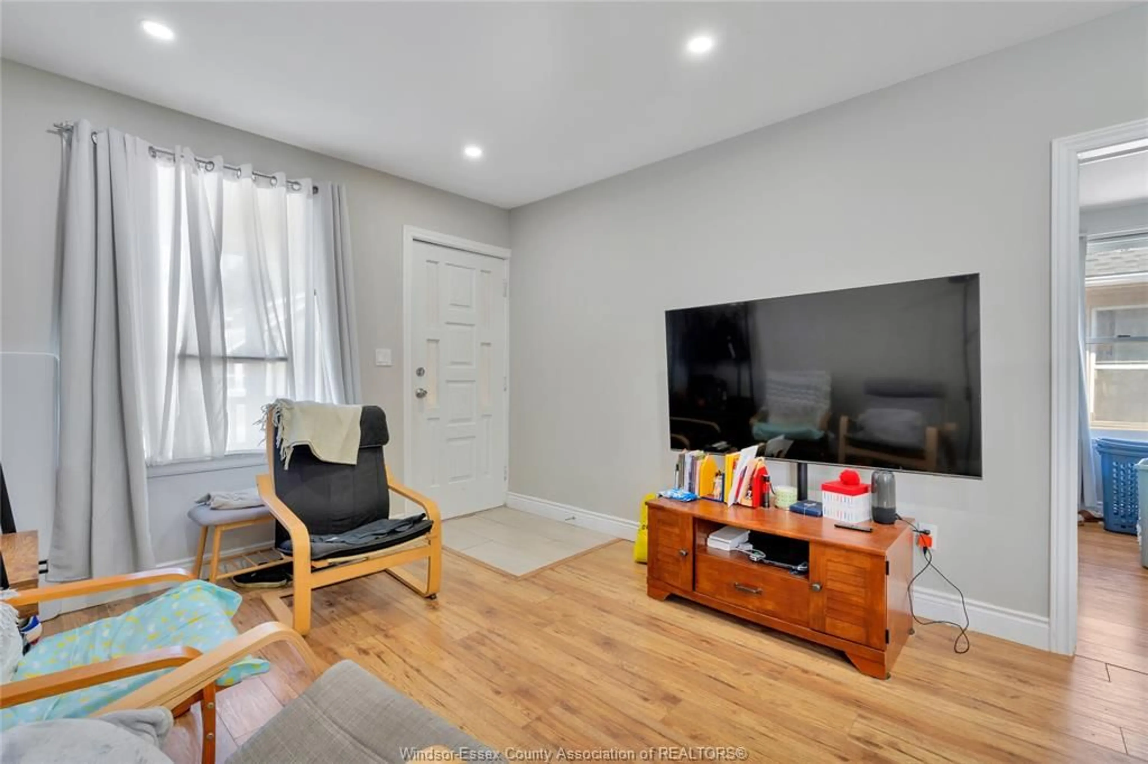 Living room with furniture, wood/laminate floor for 1396 LILLIAN Ave, Windsor Ontario N8X 4A5