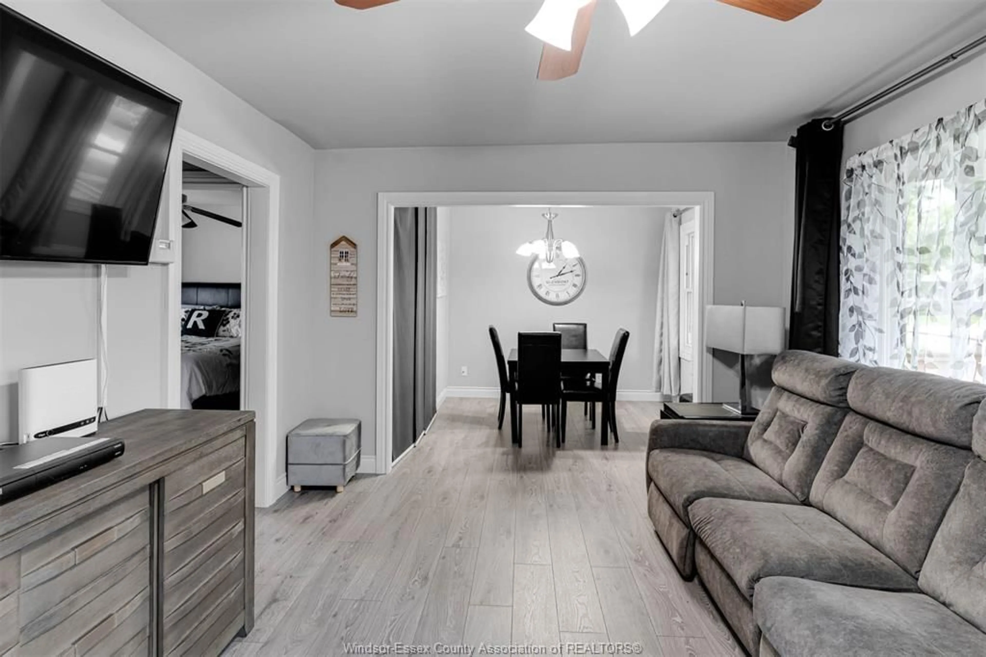 Living room with furniture, wood/laminate floor for 3685 QUEEN St, Windsor Ontario N9C 1P1