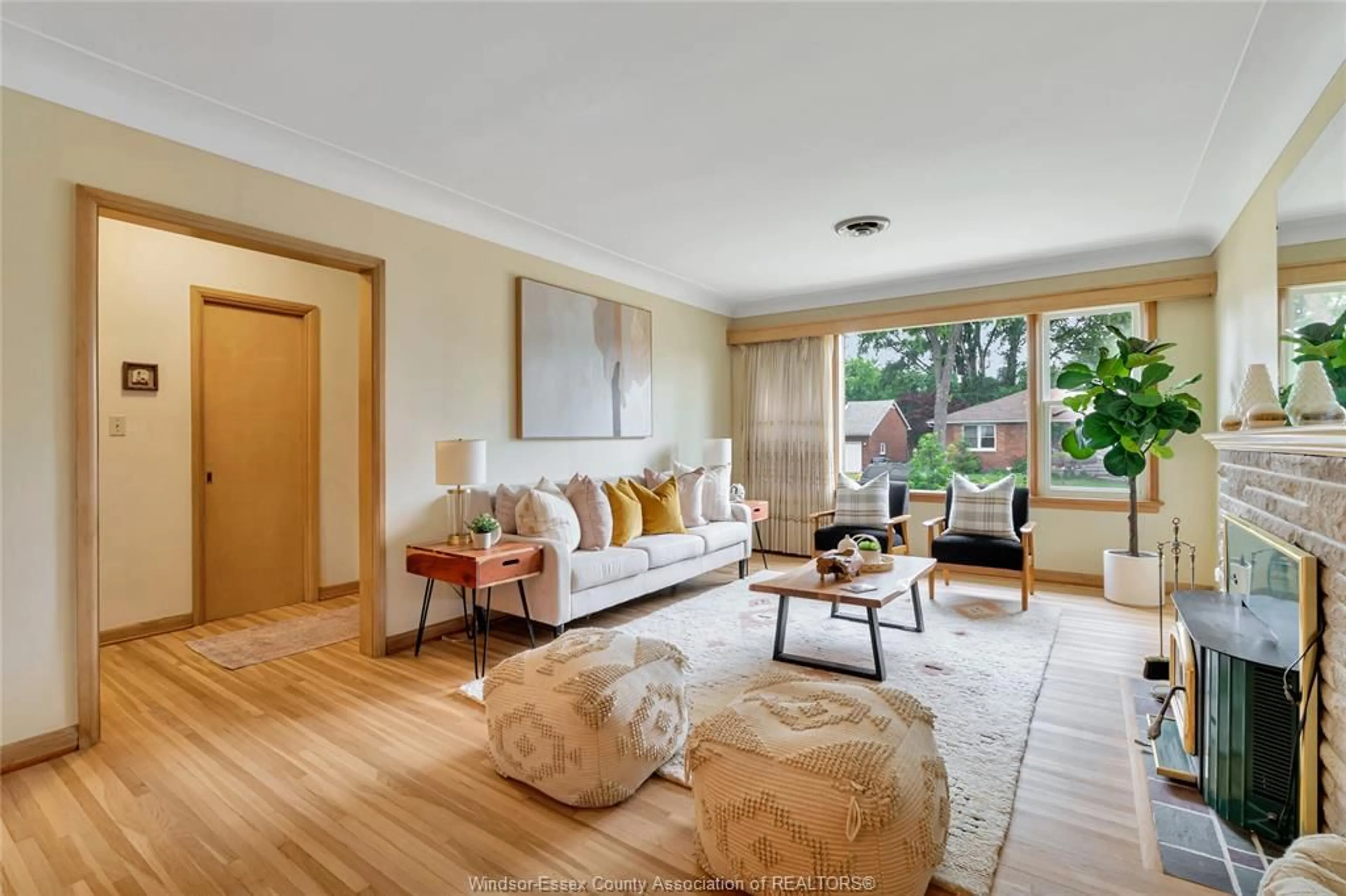 Living room with furniture, wood/laminate floor for 273 HENKEL Pl, Windsor Ontario N8Y 2E8