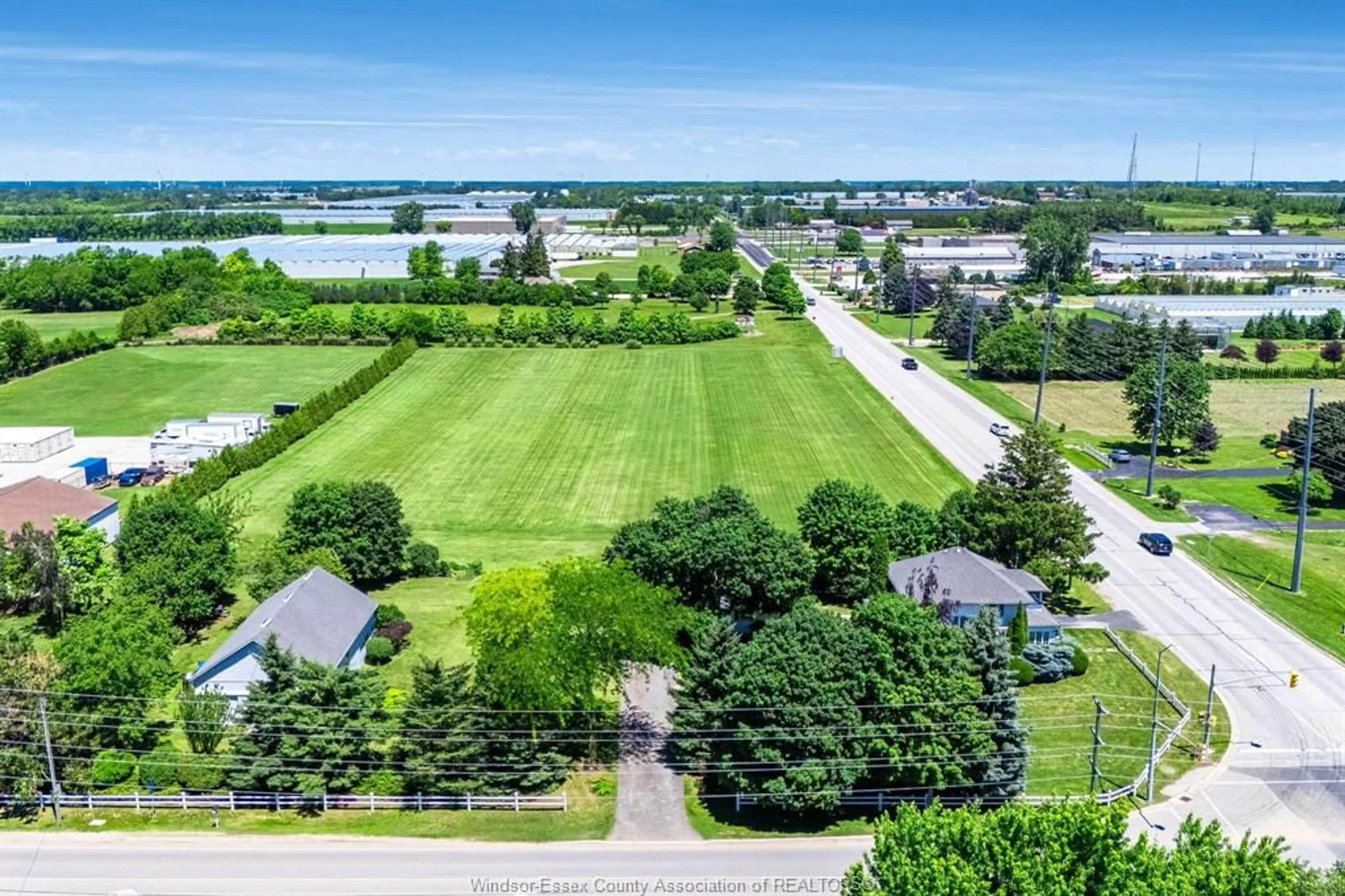 A pic from outside/outdoor area/front of a property/back of a property/a pic from drone, water/lake/river/ocean view for 1570 Road 3 East, Kingsville Ontario N9Y 2E5
