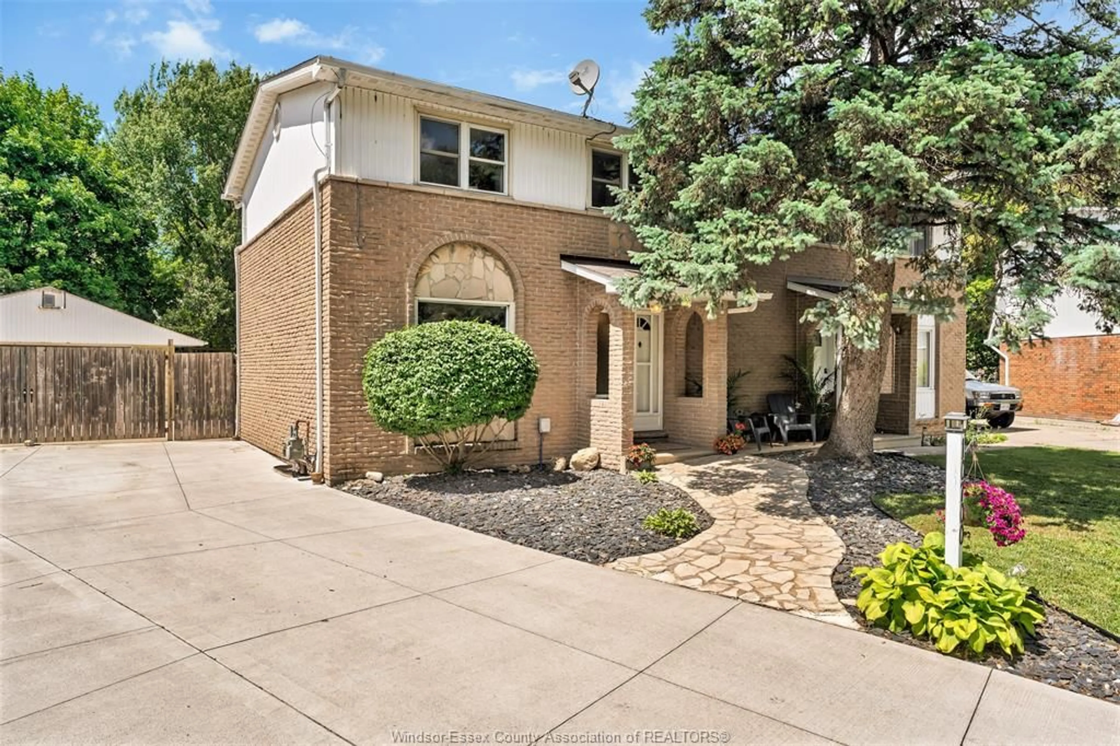 Home with brick exterior material, street for 10700 ATWATER Cres, Windsor Ontario N8R 1N6