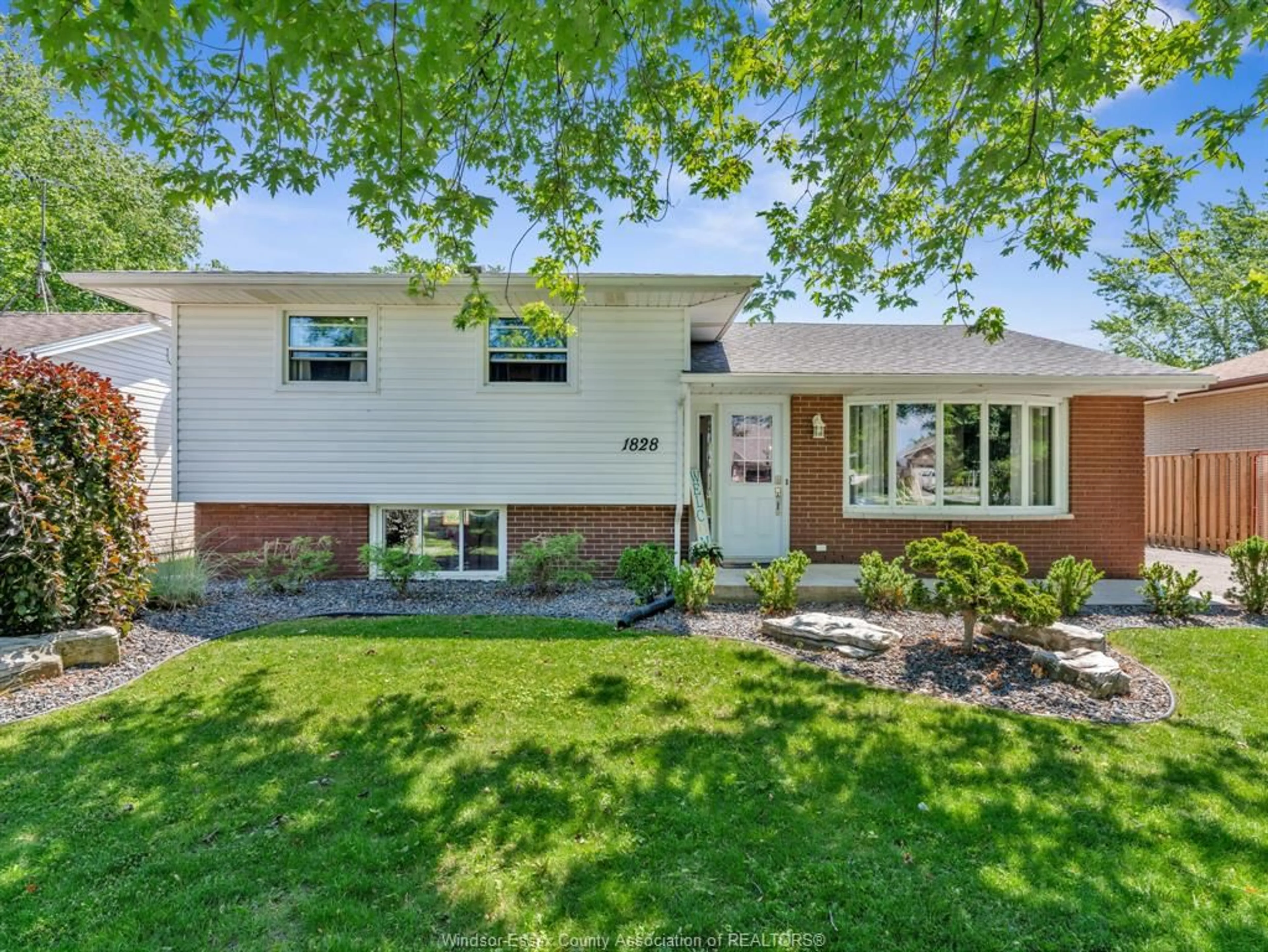 Home with vinyl exterior material, street for 1828 Service Rd, Kingsville Ontario N0P 2G0