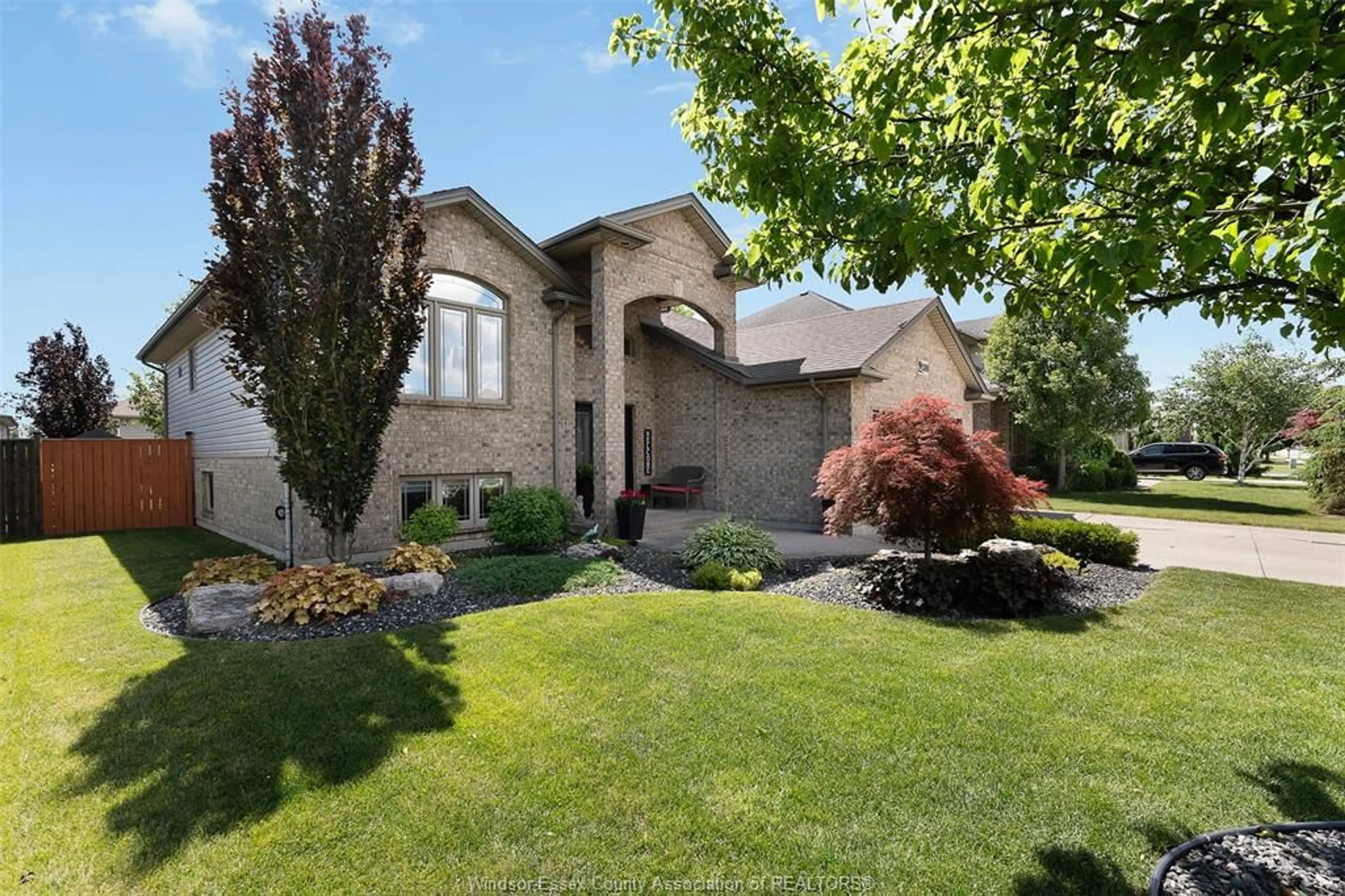 Home with brick exterior material, street for 1389 CROSSWINDS Dr, Lakeshore Ontario N8L 0S6