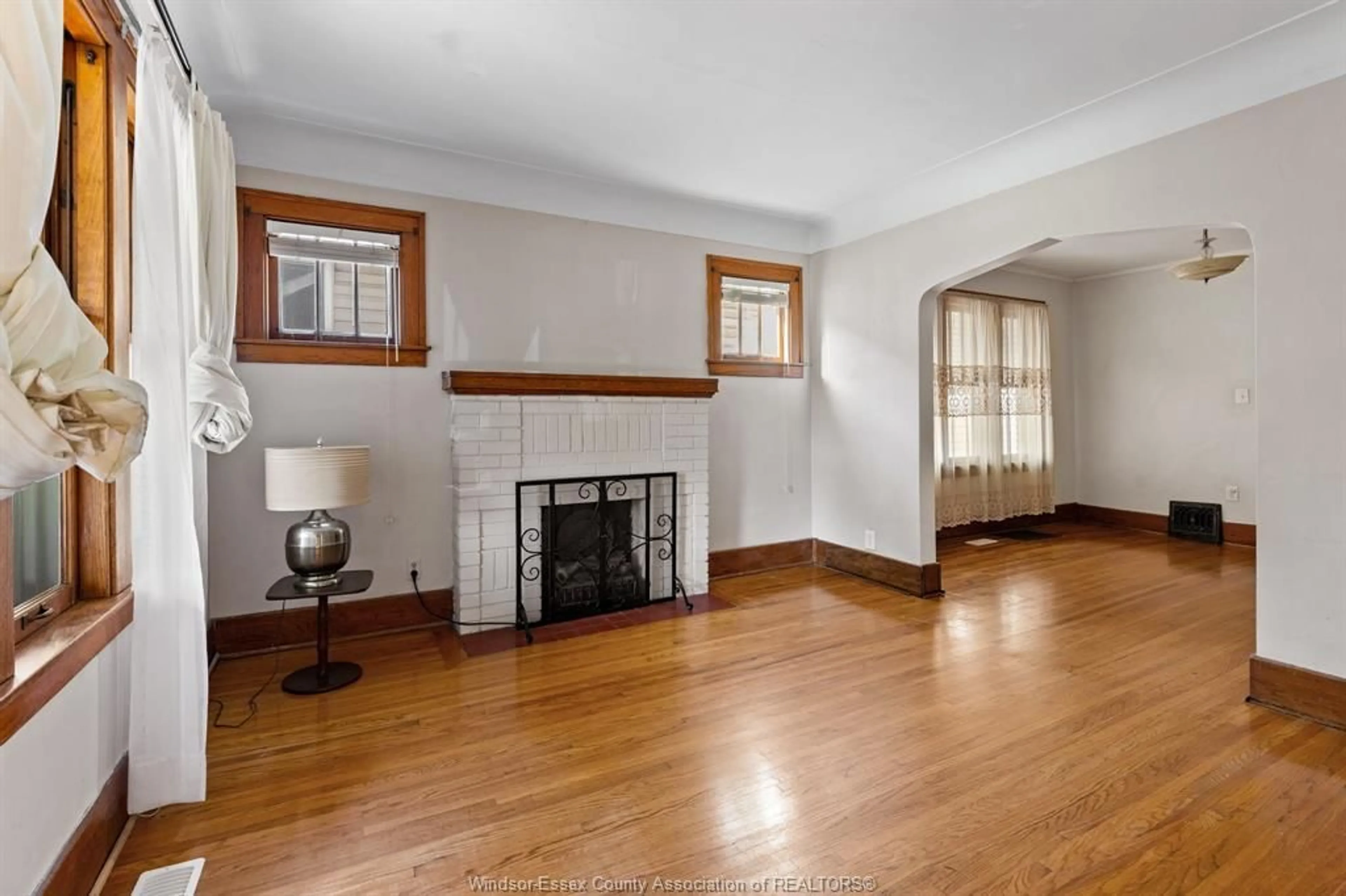 Living room with furniture, wood/laminate floor for 703 RANDOLPH, Windsor Ontario N9B 2T7