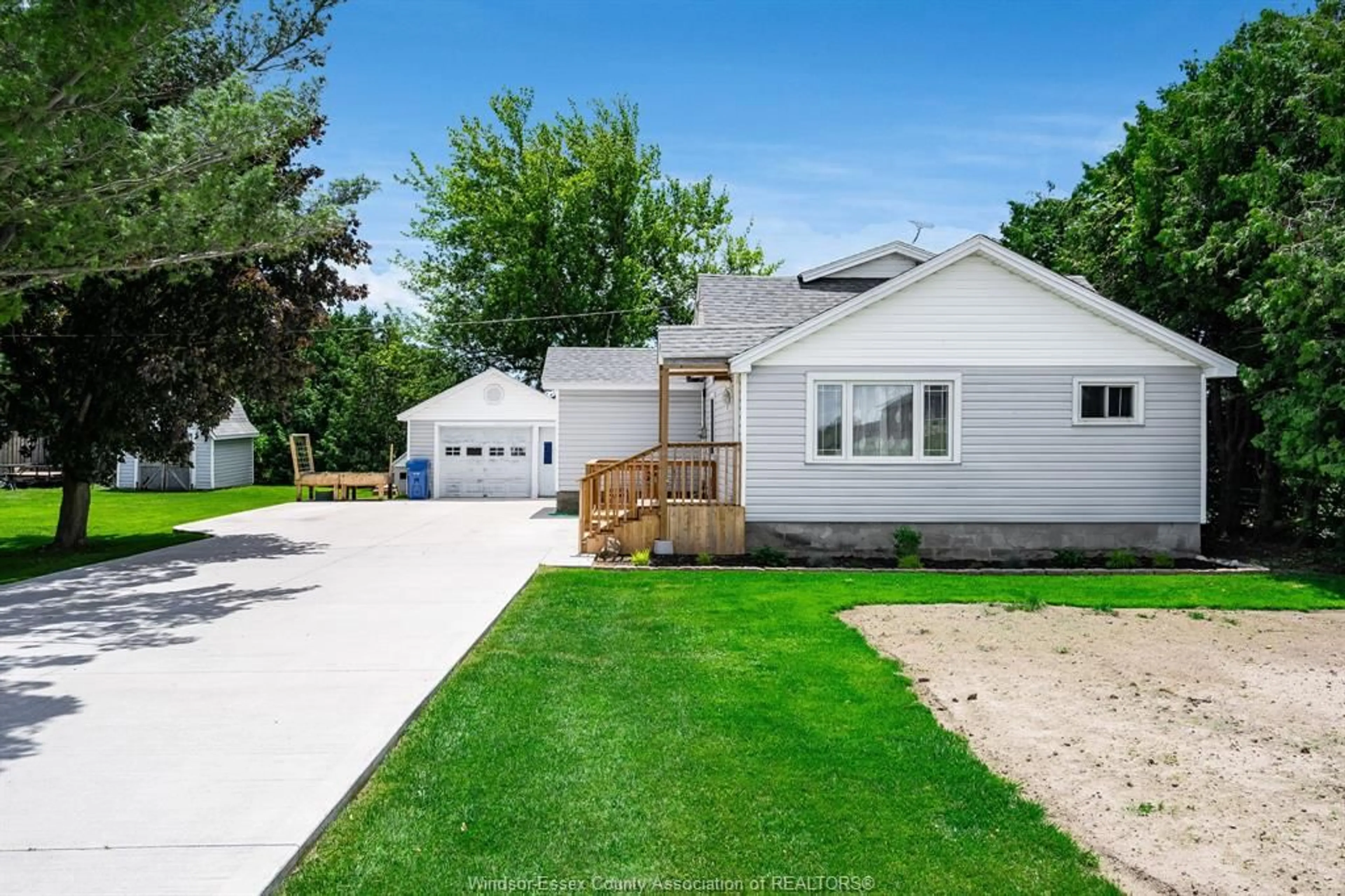A pic from outside/outdoor area/front of a property/back of a property/a pic from drone, street for 918 Mersea Road 6, Leamington Ontario N8H 3V8