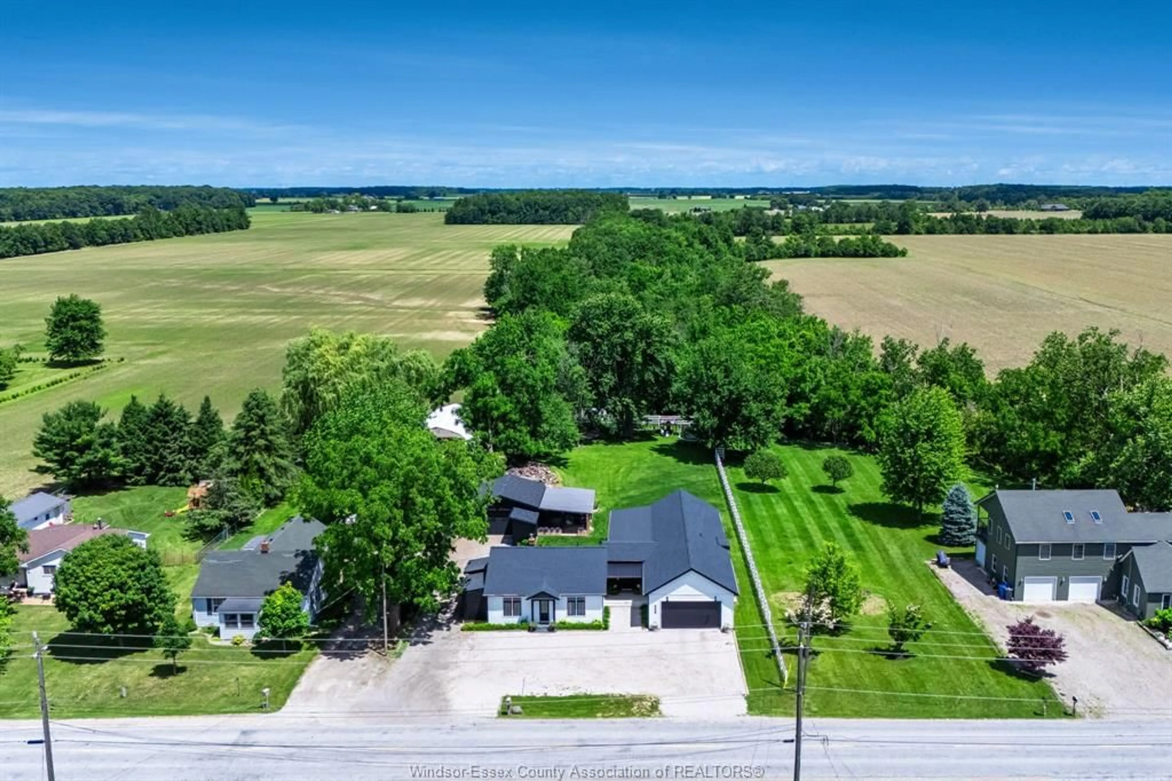 A pic from outside/outdoor area/front of a property/back of a property/a pic from drone, street for 568 Road 2 W, Kingsville Ontario N9Y 2E4