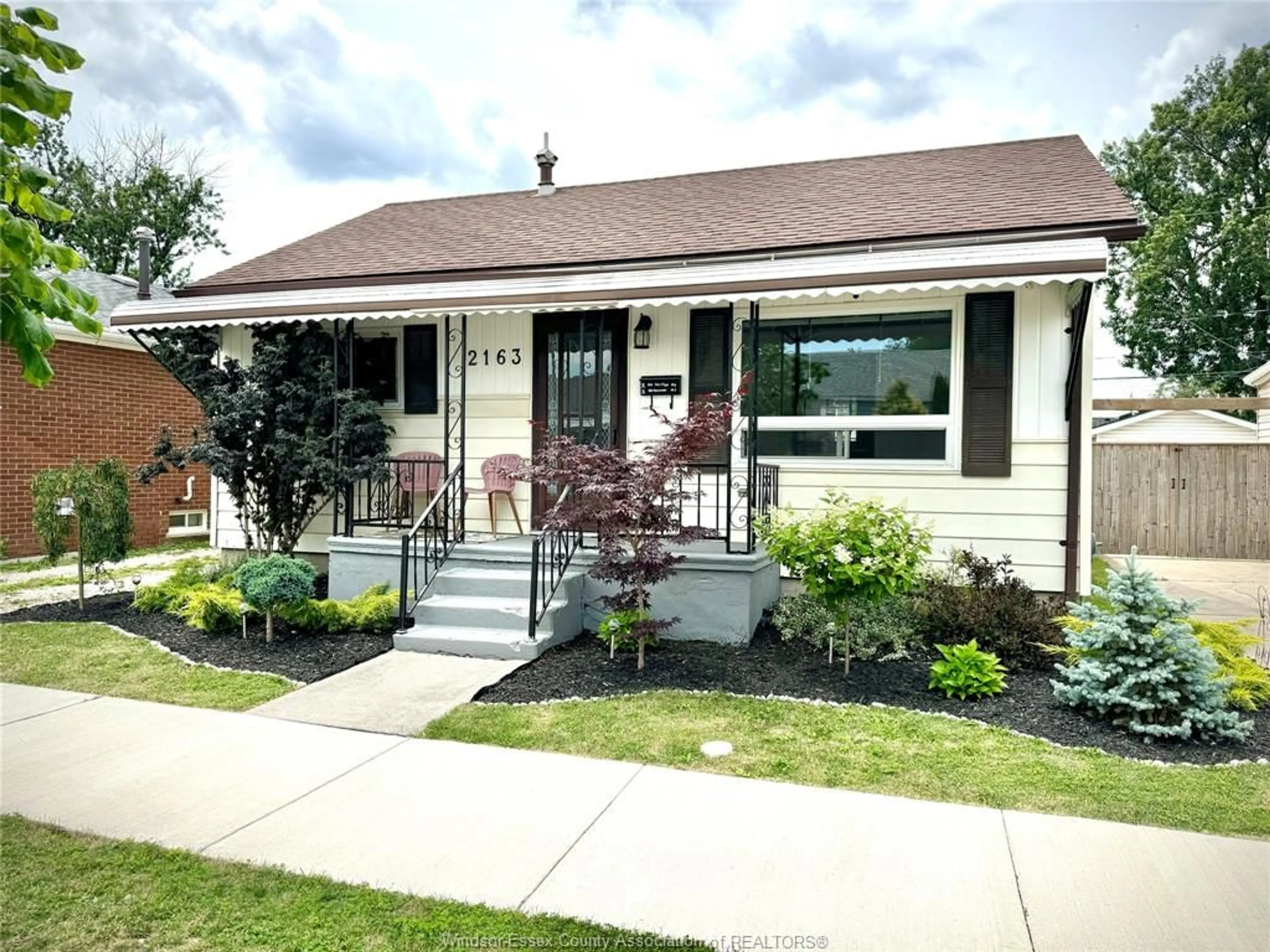Home with vinyl exterior material, street for 2163 WELLESLEY Ave, Windsor Ontario N8W 2E8