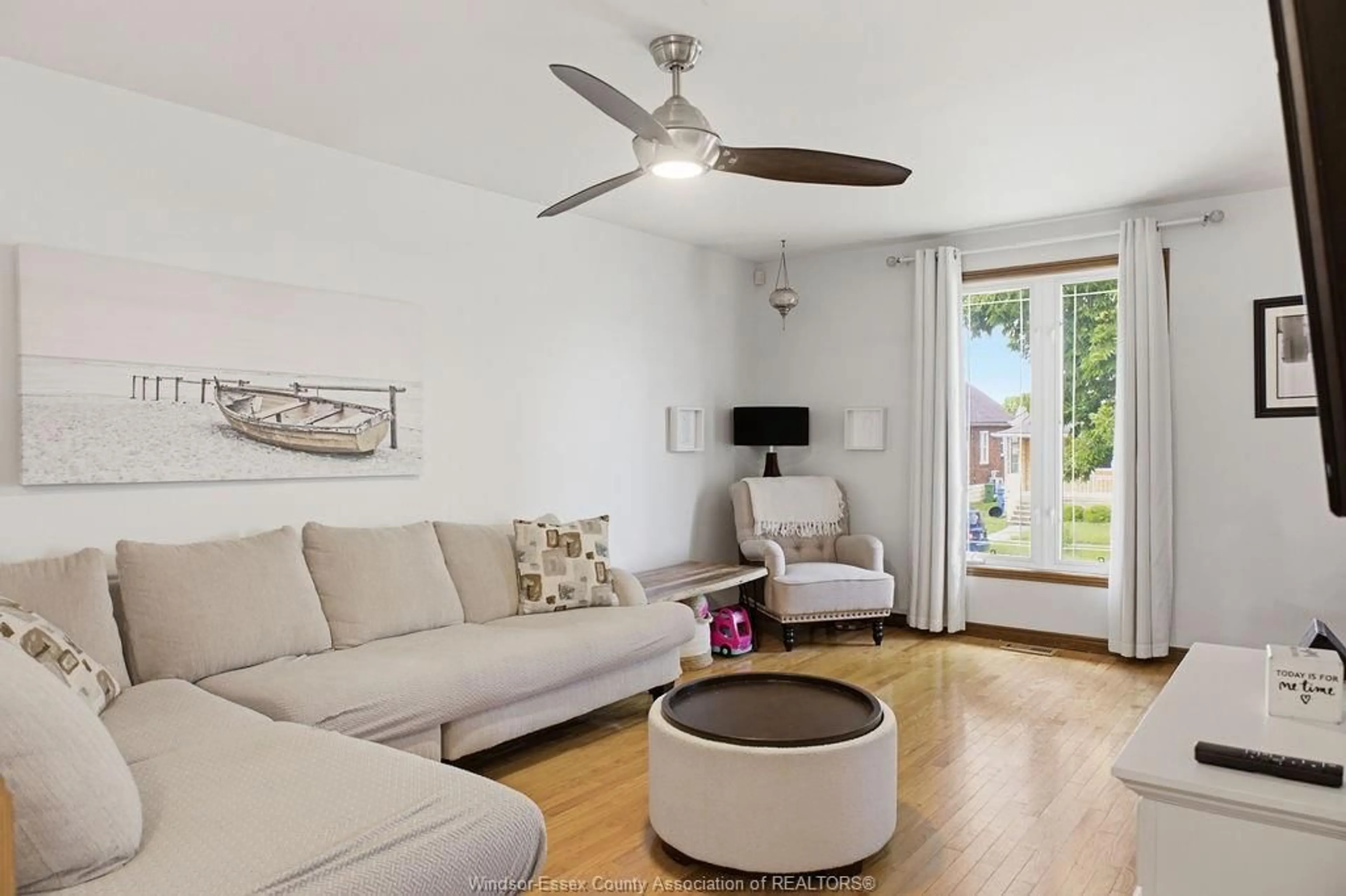 Living room with furniture, wood/laminate floor for 1646 LANGLOIS Ave, Windsor Ontario N8X 4M5