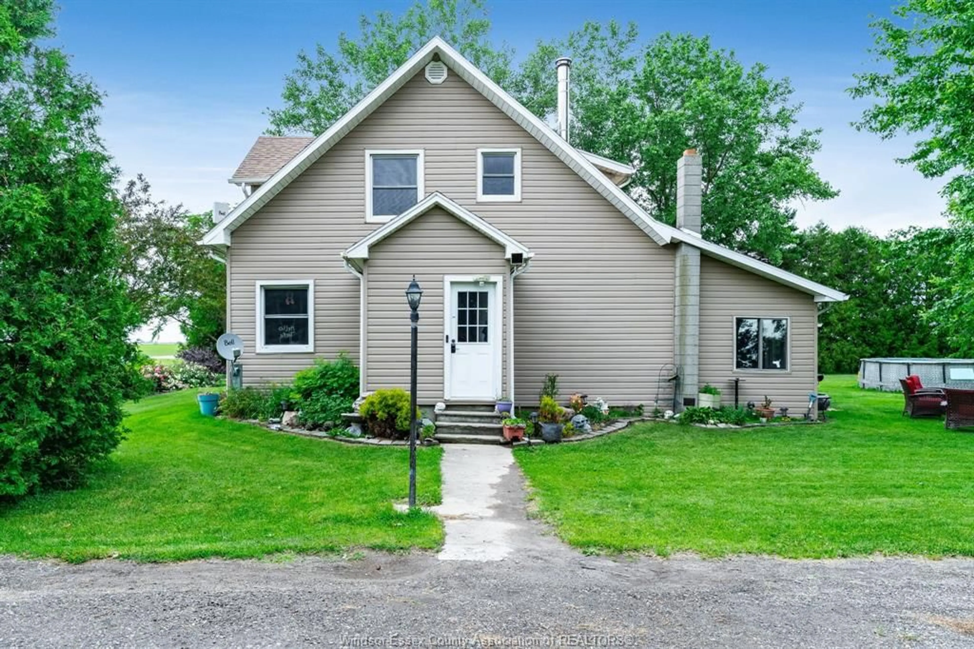 Home with vinyl exterior material, street for 2438 4th Concession Line, Chatham-Kent Ontario N0P 1H0