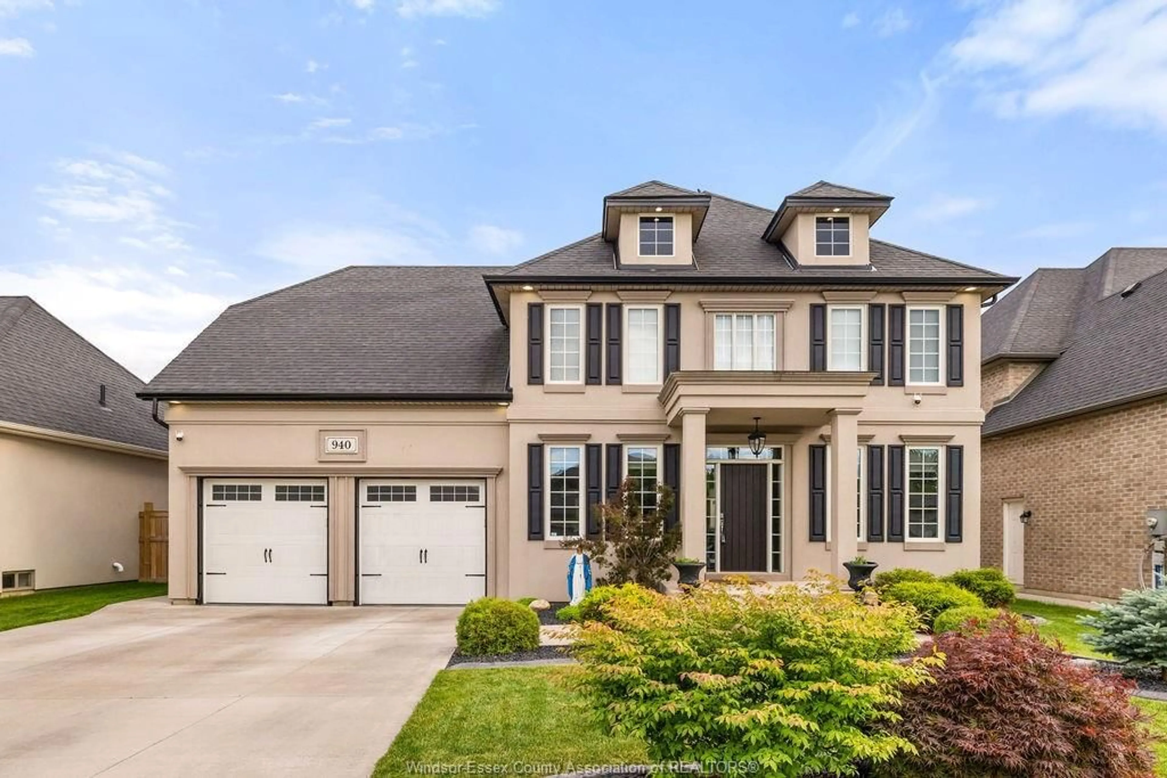 Home with brick exterior material, street for 940 WESTWOOD Dr, Lakeshore Ontario N0R 1A0