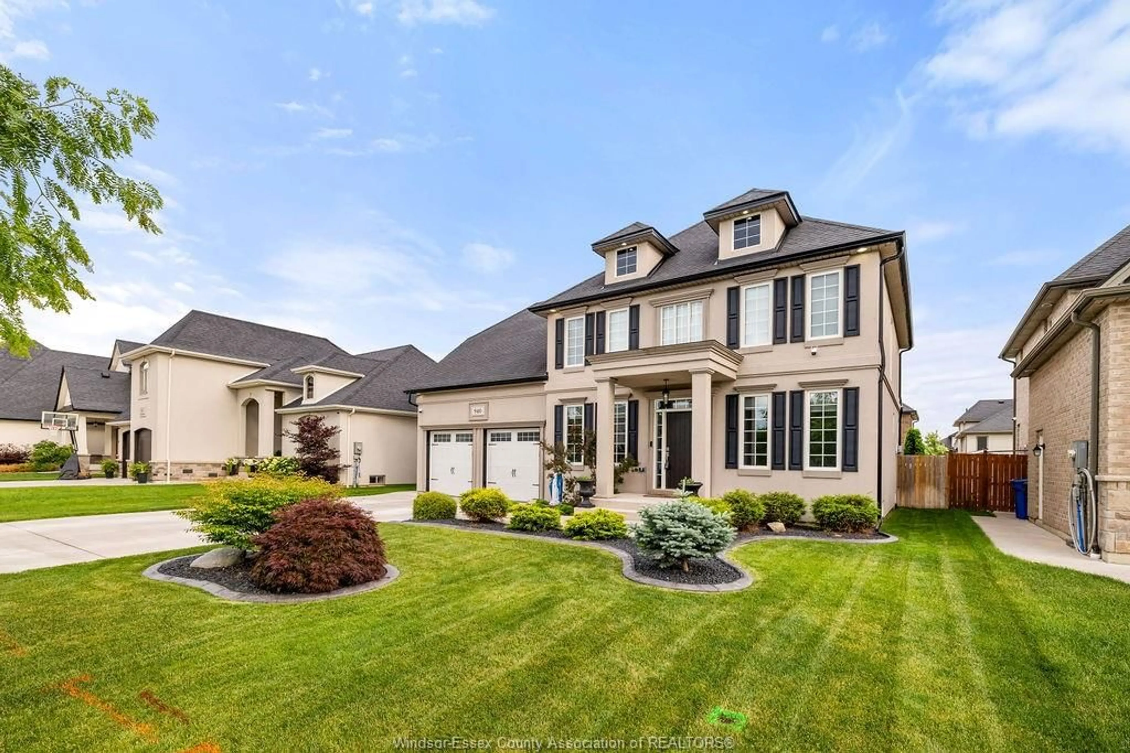 Home with vinyl exterior material, street for 940 WESTWOOD Dr, Lakeshore Ontario N0R 1A0