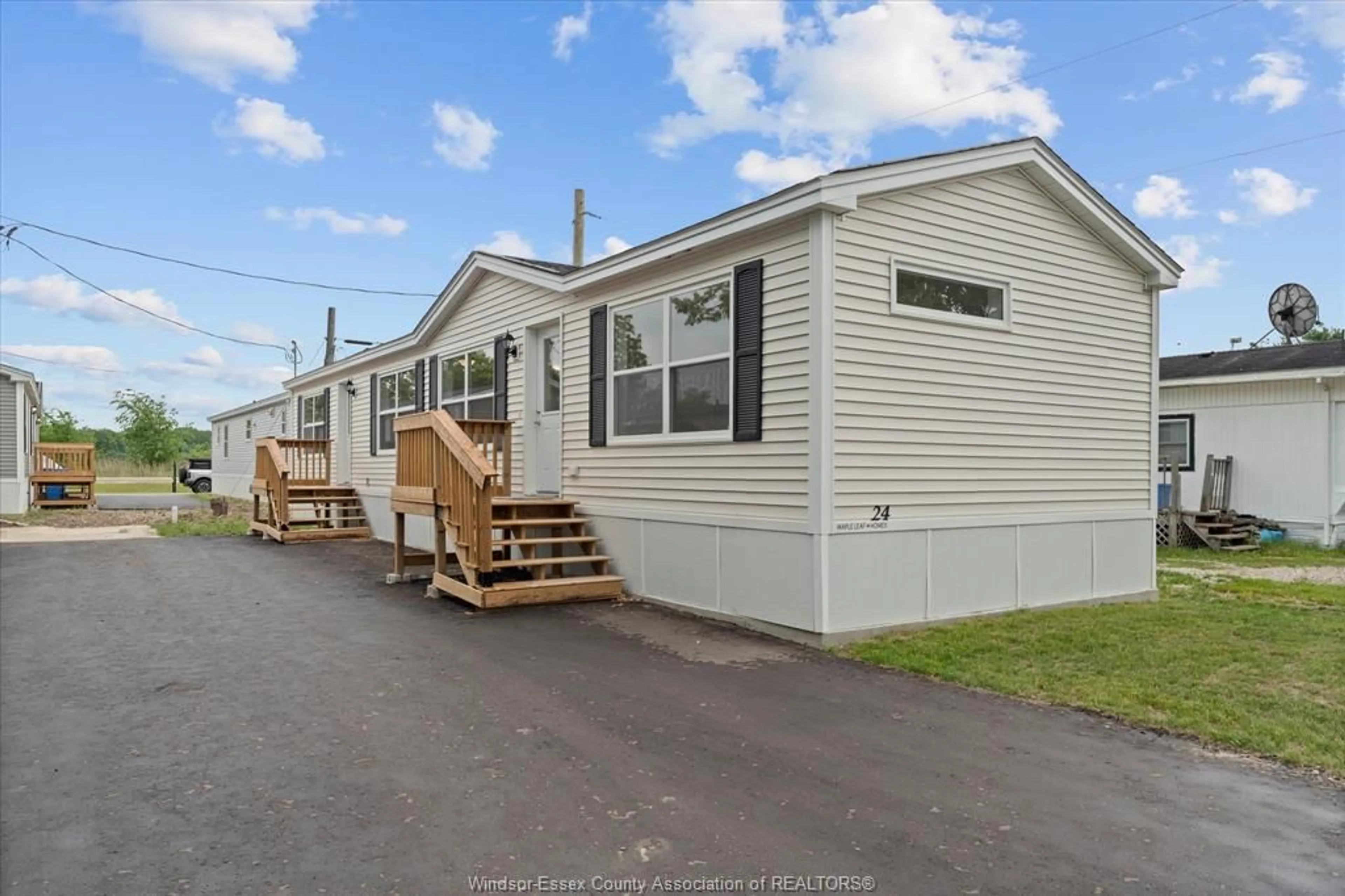 Home with vinyl exterior material, street for 24 REGINA Dr, Lakeshore Ontario N8N 2P4