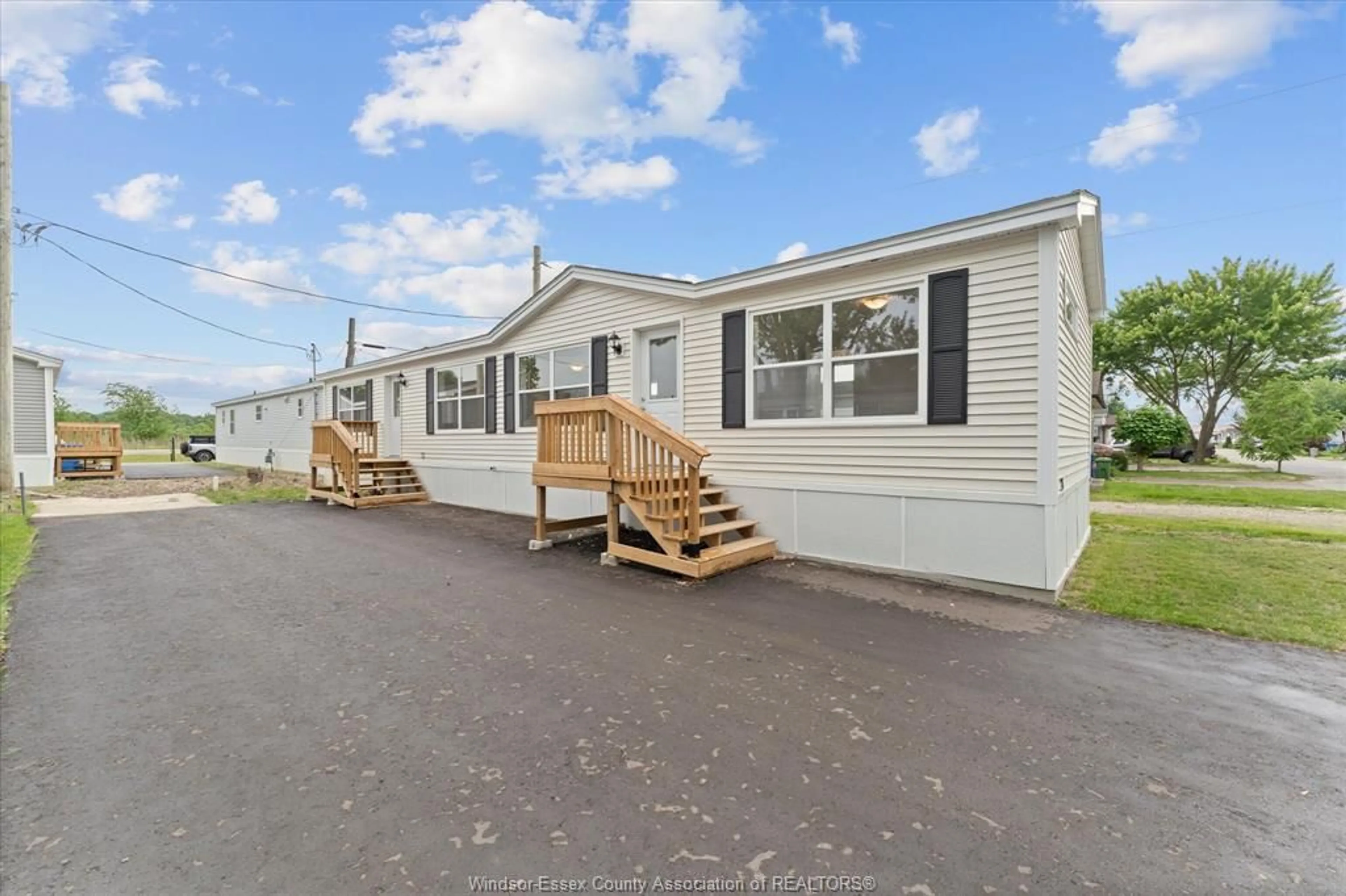 Home with vinyl exterior material, unknown for 24 REGINA Dr, Lakeshore Ontario N8N 2P4