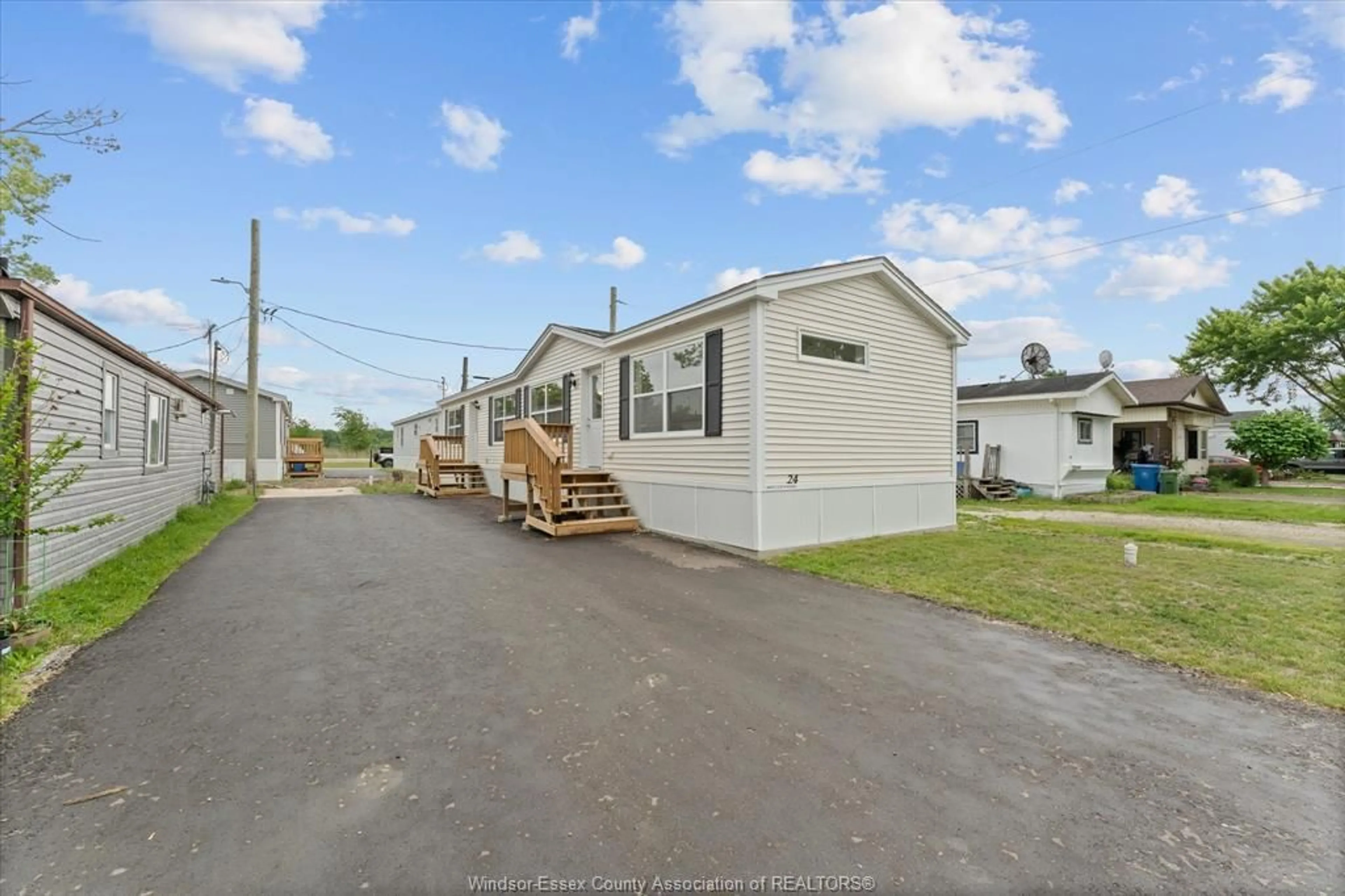 A pic from outside/outdoor area/front of a property/back of a property/a pic from drone, street for 24 REGINA Dr, Lakeshore Ontario N8N 2P4