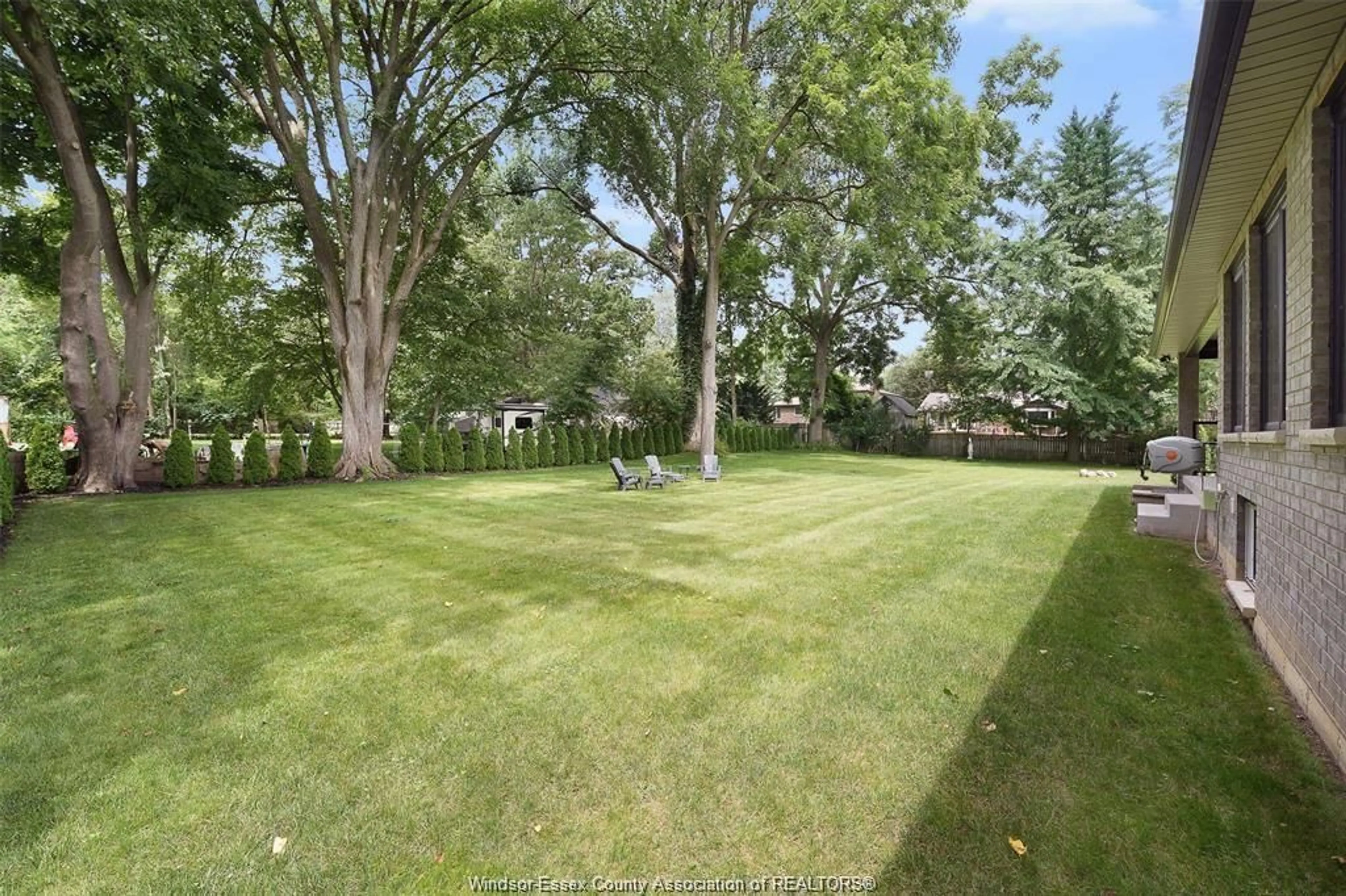 A pic from outside/outdoor area/front of a property/back of a property/a pic from drone, forest/trees view for 110 LAUREL St, Kingsville Ontario N9Y 2B4