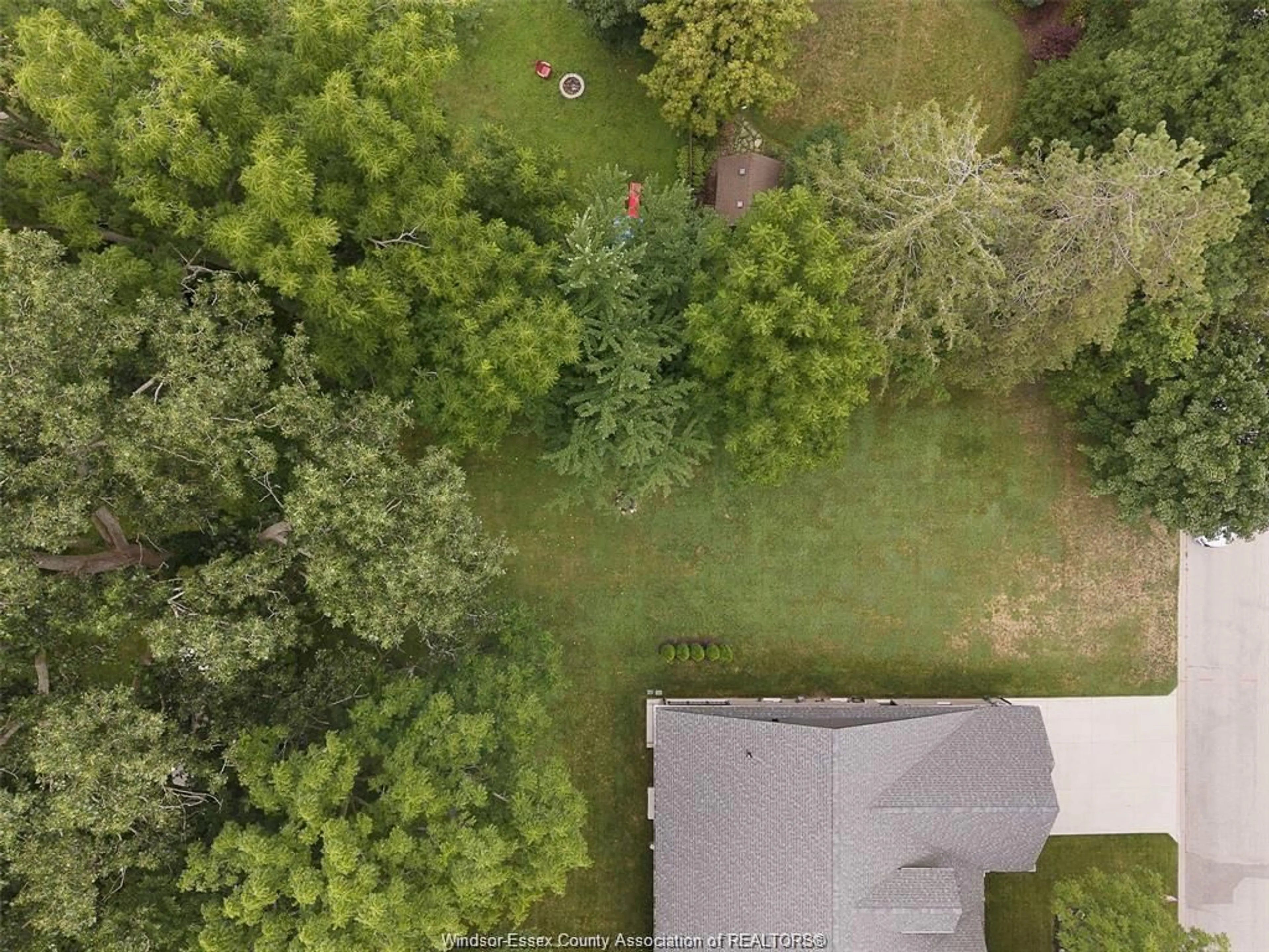 A pic from outside/outdoor area/front of a property/back of a property/a pic from drone, forest/trees view for 110 LAUREL St, Kingsville Ontario N9Y 2B4