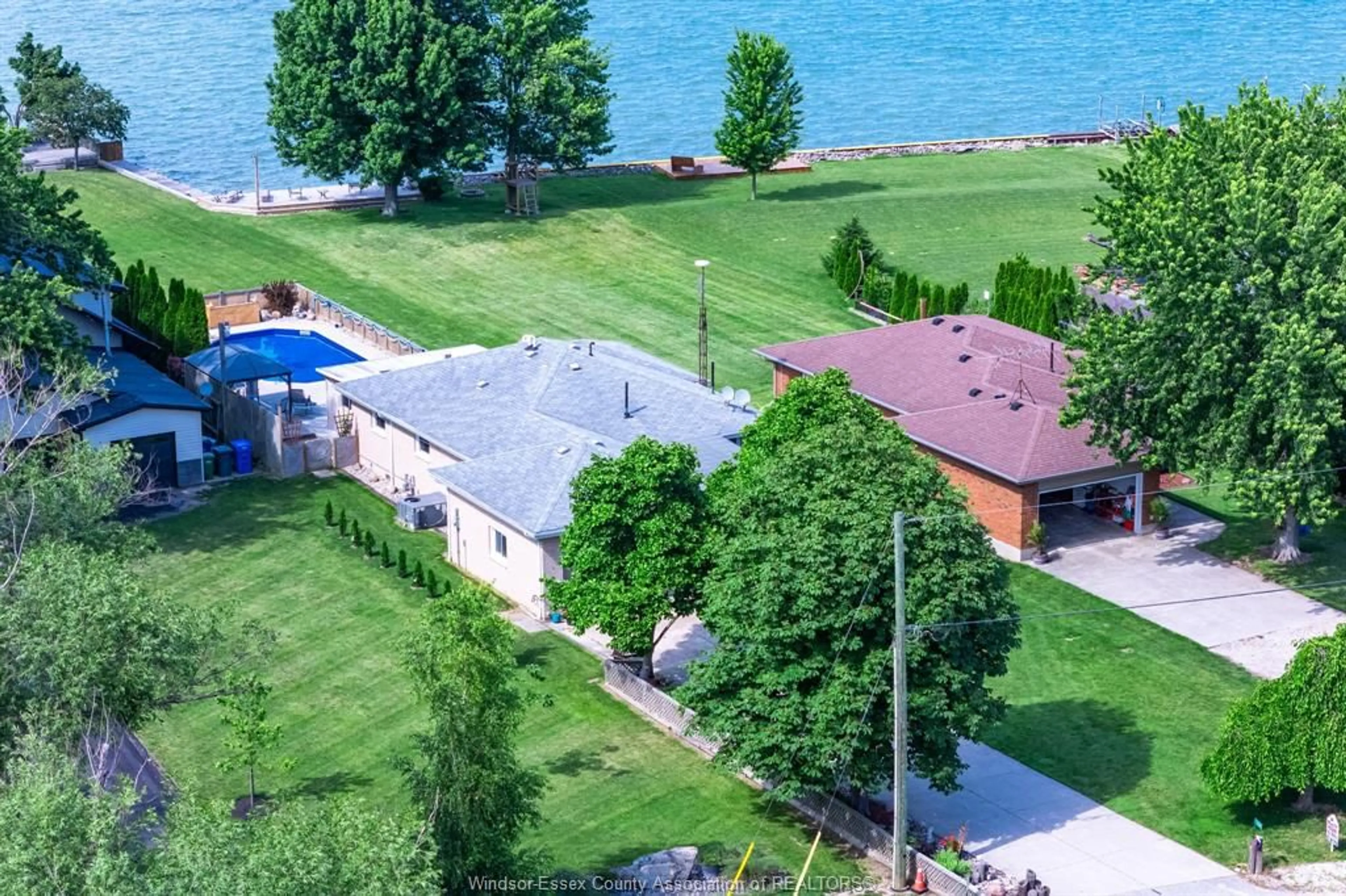 A pic from outside/outdoor area/front of a property/back of a property/a pic from drone, water/lake/river/ocean view for 12307 & 12310 Laforet Beach Rd., Lakeshore Ontario N0R 1N0