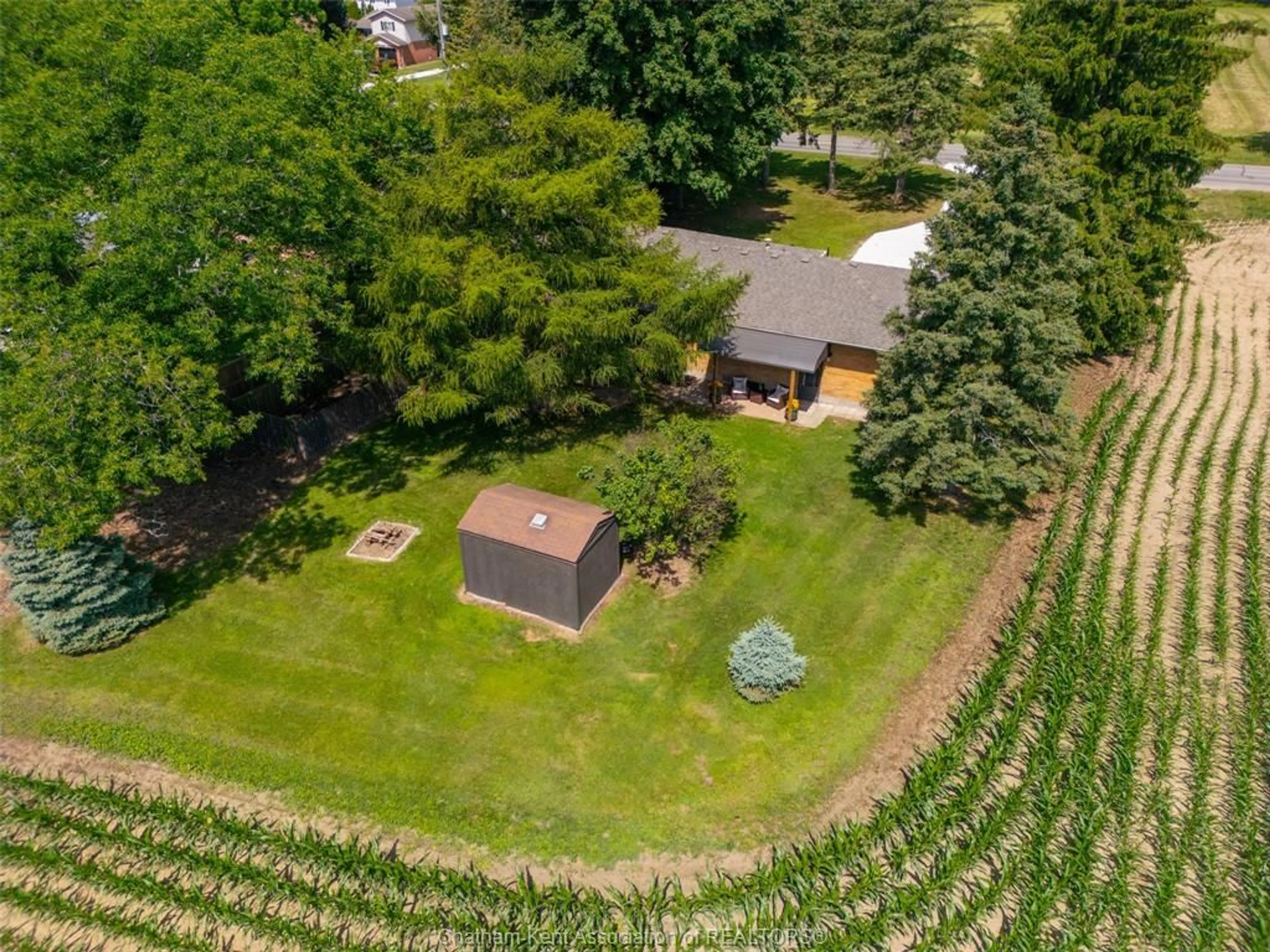 A pic from outside/outdoor area/front of a property/back of a property/a pic from drone, forest/trees view for 140 Gregory Dr, Chatham Township Ontario N7L 0E1
