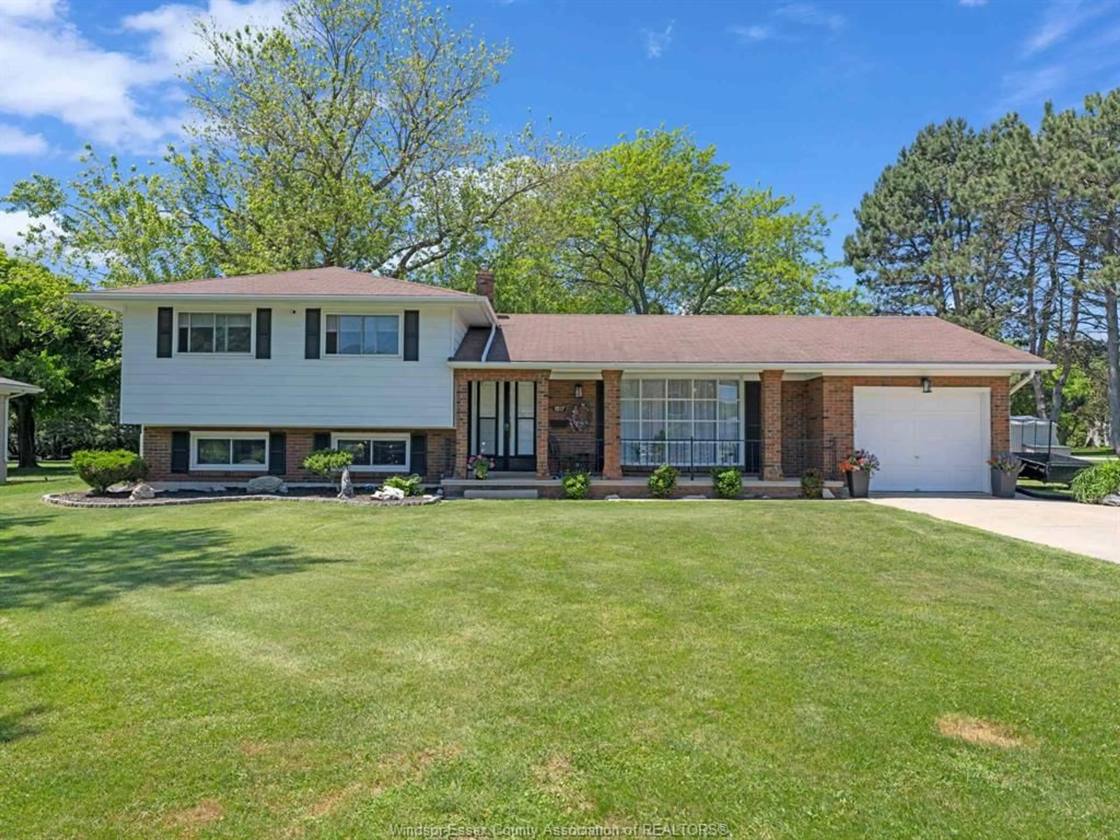 Home with vinyl exterior material, street for 1517 Redwood Rd, Kingsville Ontario N9Y 2V4