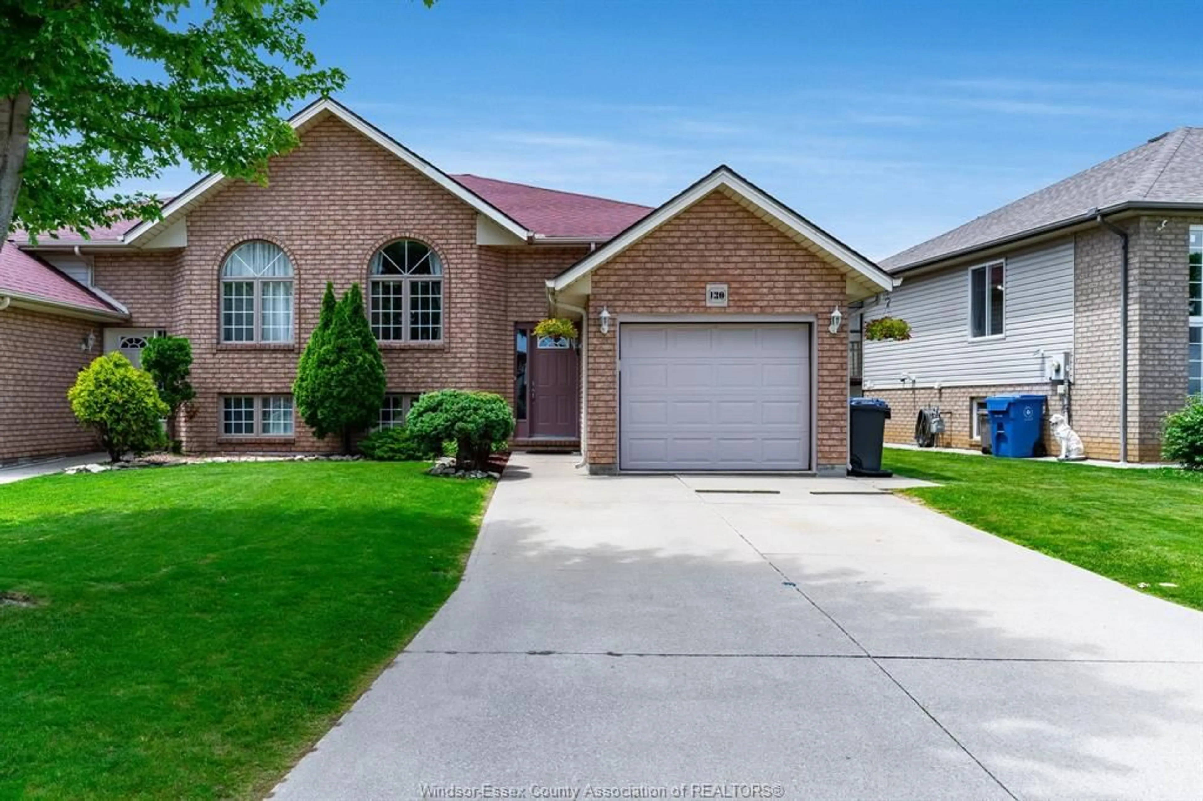 Home with brick exterior material, street for 130 Sturgeon Meadows Ave, Leamington Ontario N8H 5L1