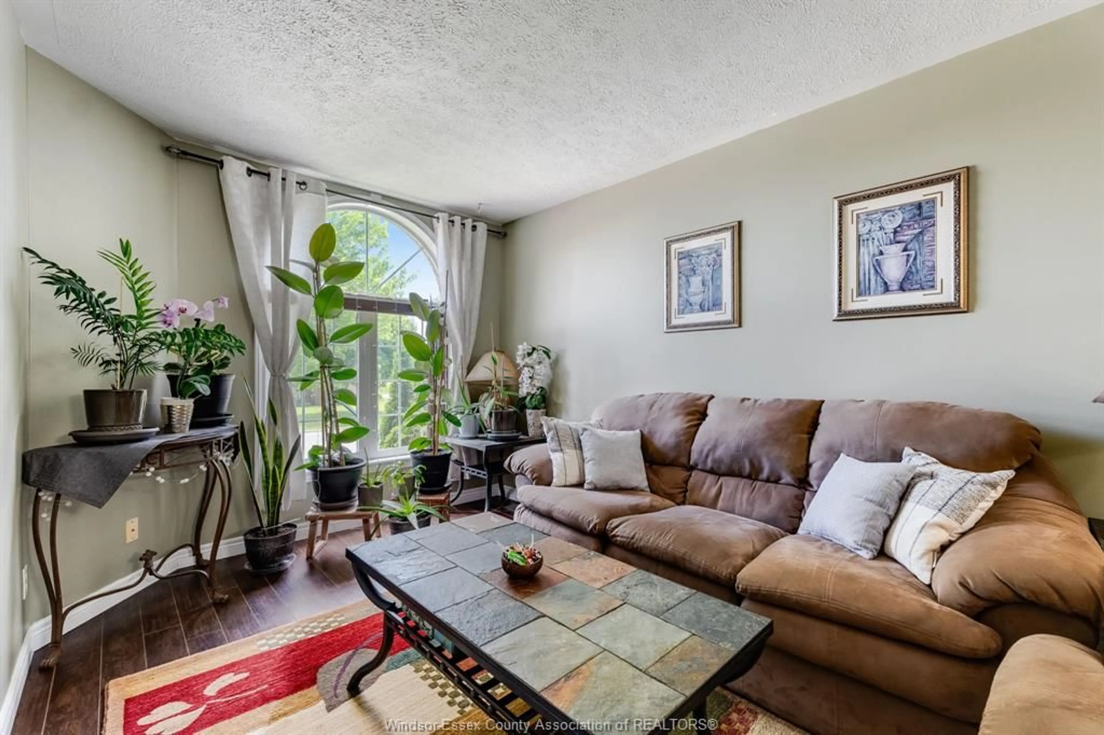 Living room with furniture, unknown for 130 Sturgeon Meadows Ave, Leamington Ontario N8H 5L1