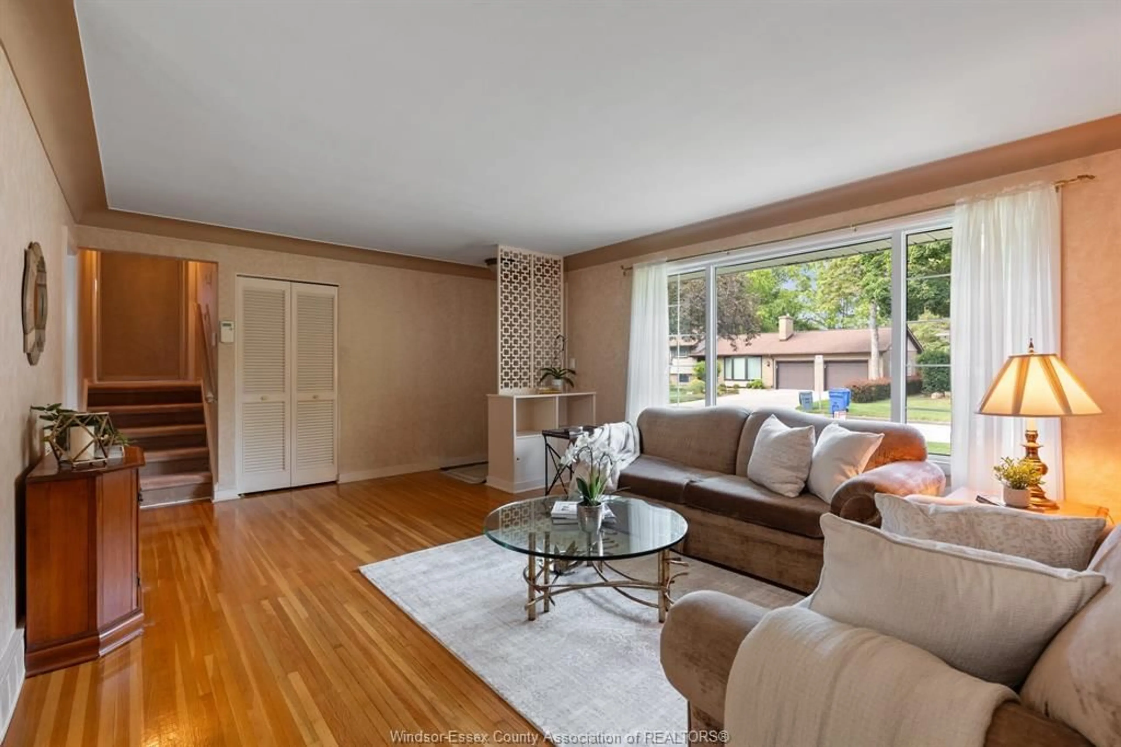 Living room with furniture, wood/laminate floor for 3659 BRUCE Ave, Windsor Ontario N9E 1W4