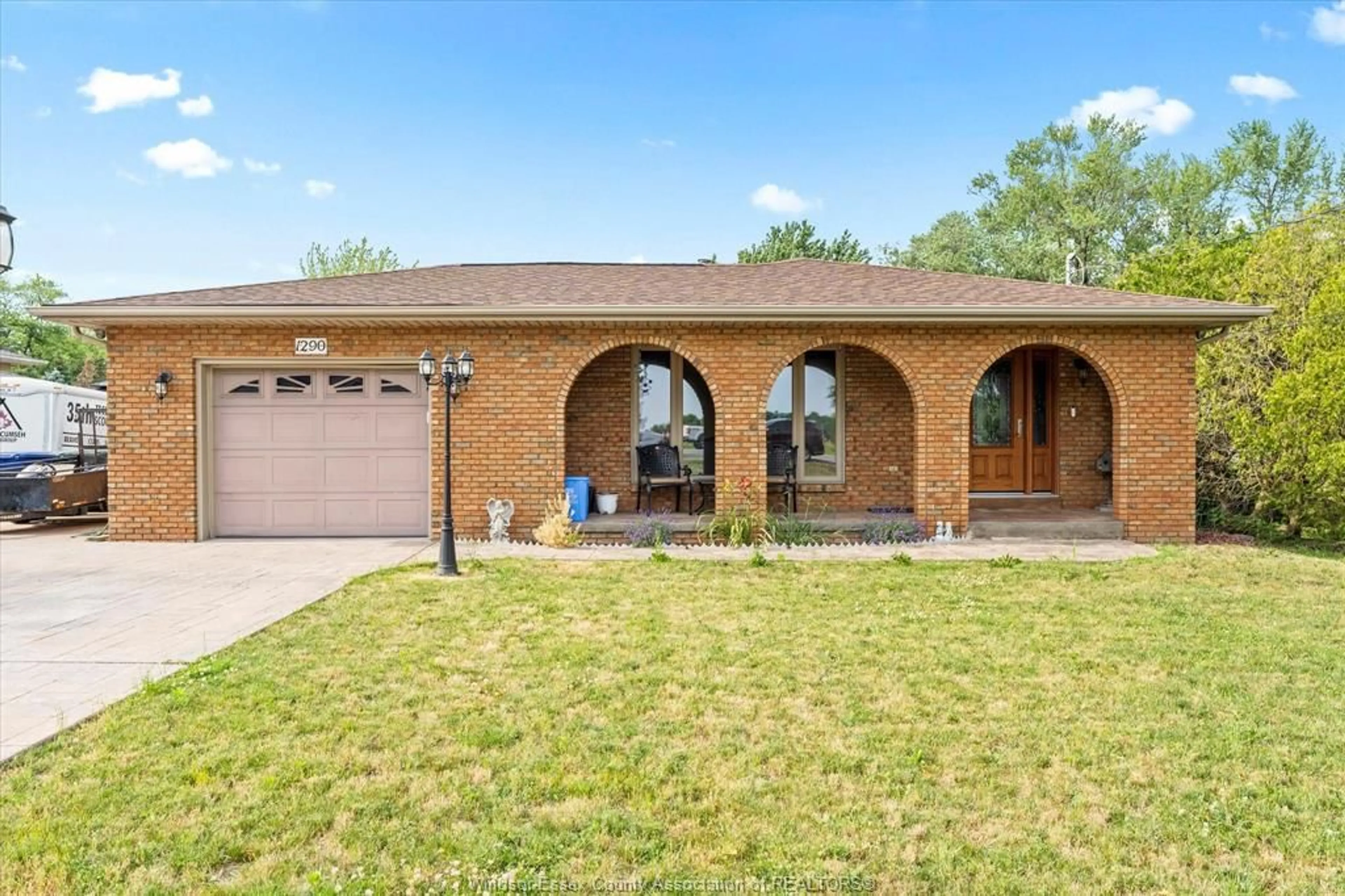 Home with brick exterior material, street for 1290 County Road 22, Lakeshore Ontario N0R 1A0
