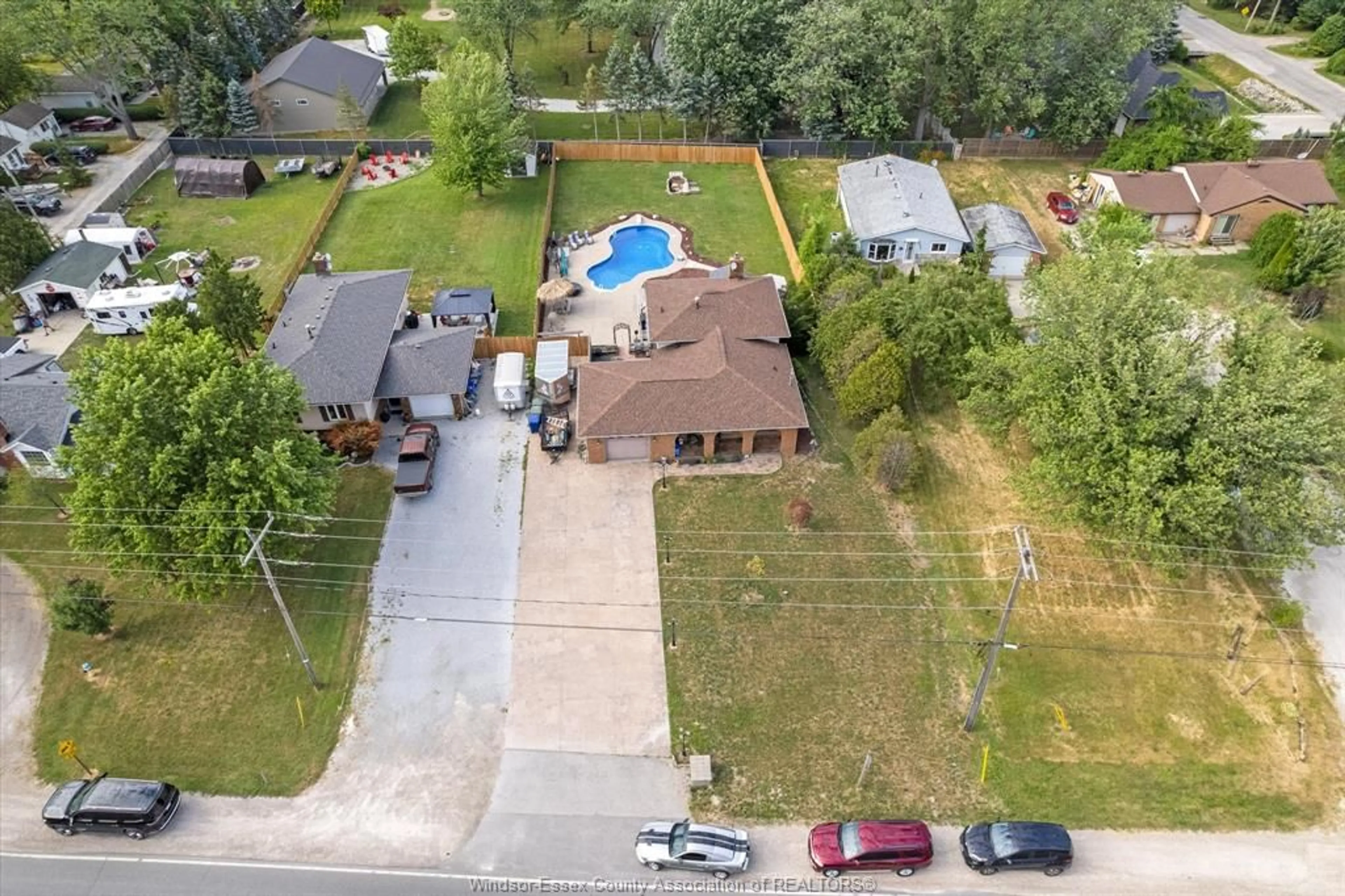 A pic from outside/outdoor area/front of a property/back of a property/a pic from drone, street for 1290 County Road 22, Lakeshore Ontario N0R 1A0