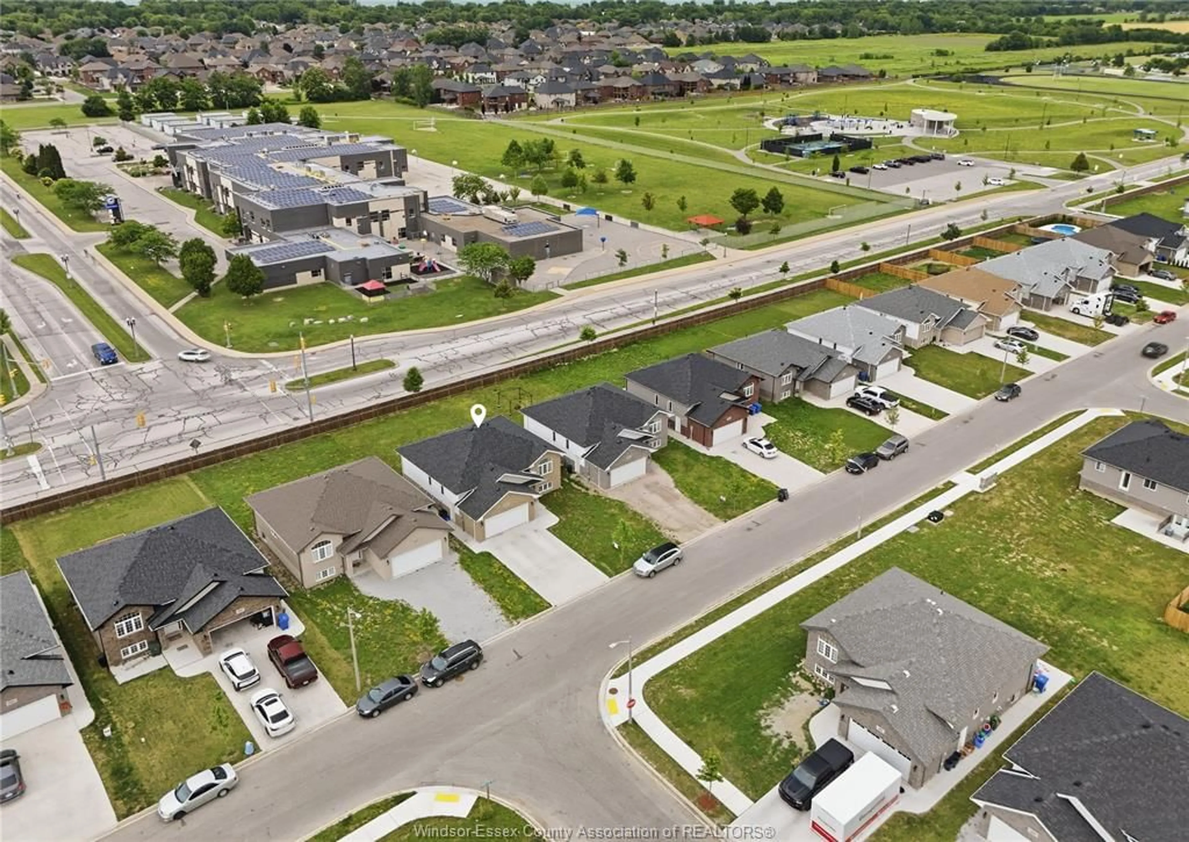 A pic from outside/outdoor area/front of a property/back of a property/a pic from drone, street for 1157 ASPEN RIDGE Cres, Lakeshore Ontario N0R 1A0