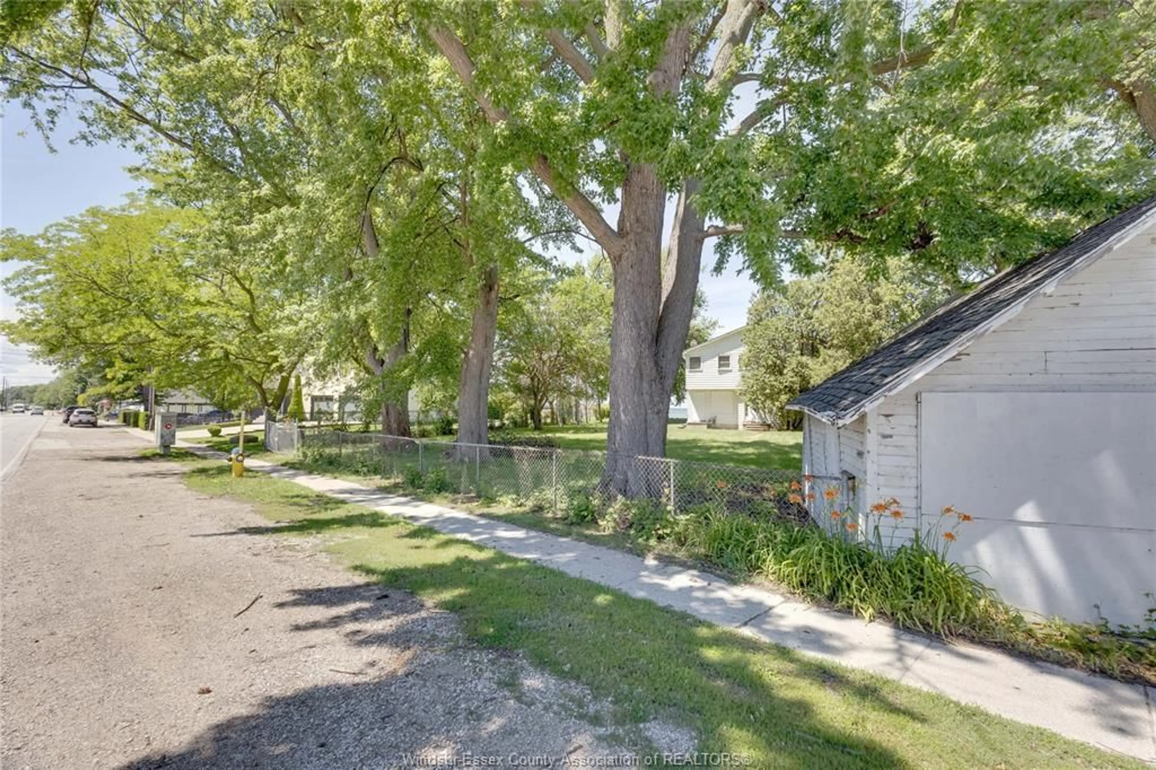 A pic from outside/outdoor area/front of a property/back of a property/a pic from drone, street for 13110 RIVERSIDE Dr, Tecumseh Ontario N8N 2M6