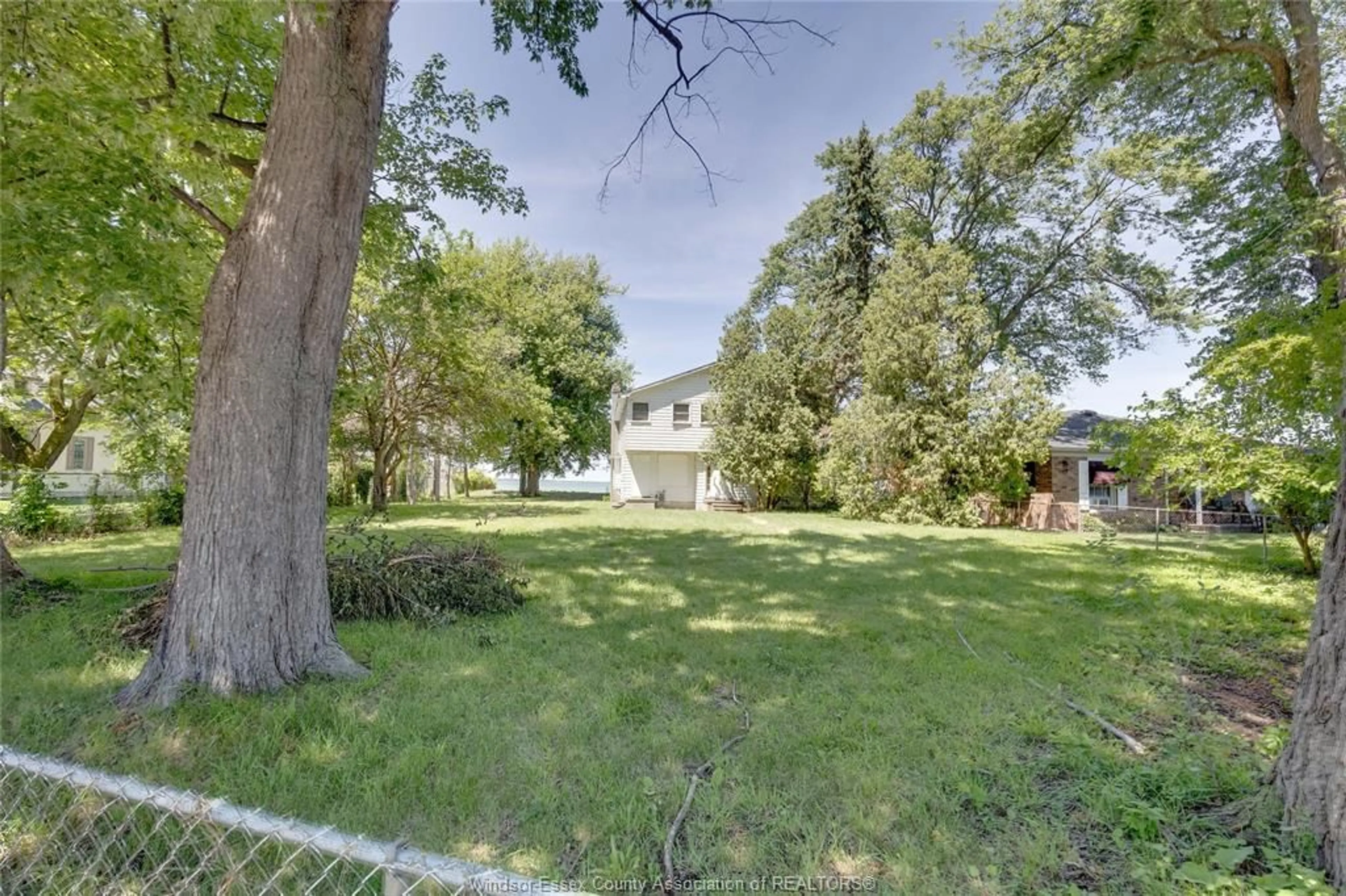 A pic from outside/outdoor area/front of a property/back of a property/a pic from drone, street for 13110 RIVERSIDE Dr, Tecumseh Ontario N8N 2M6