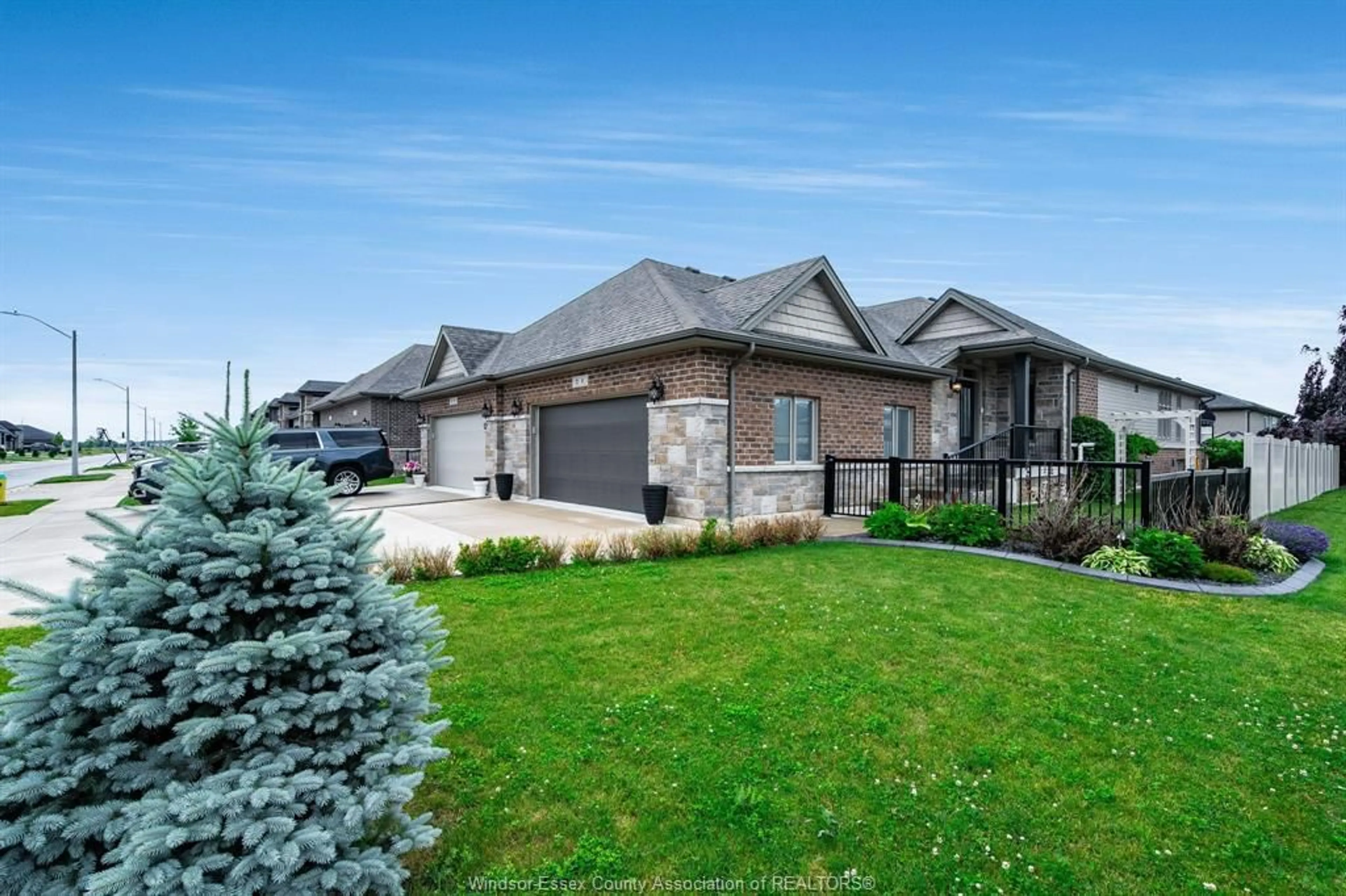 Home with brick exterior material, street for 1 Woodland St, Kingsville Ontario N9Y 0B1