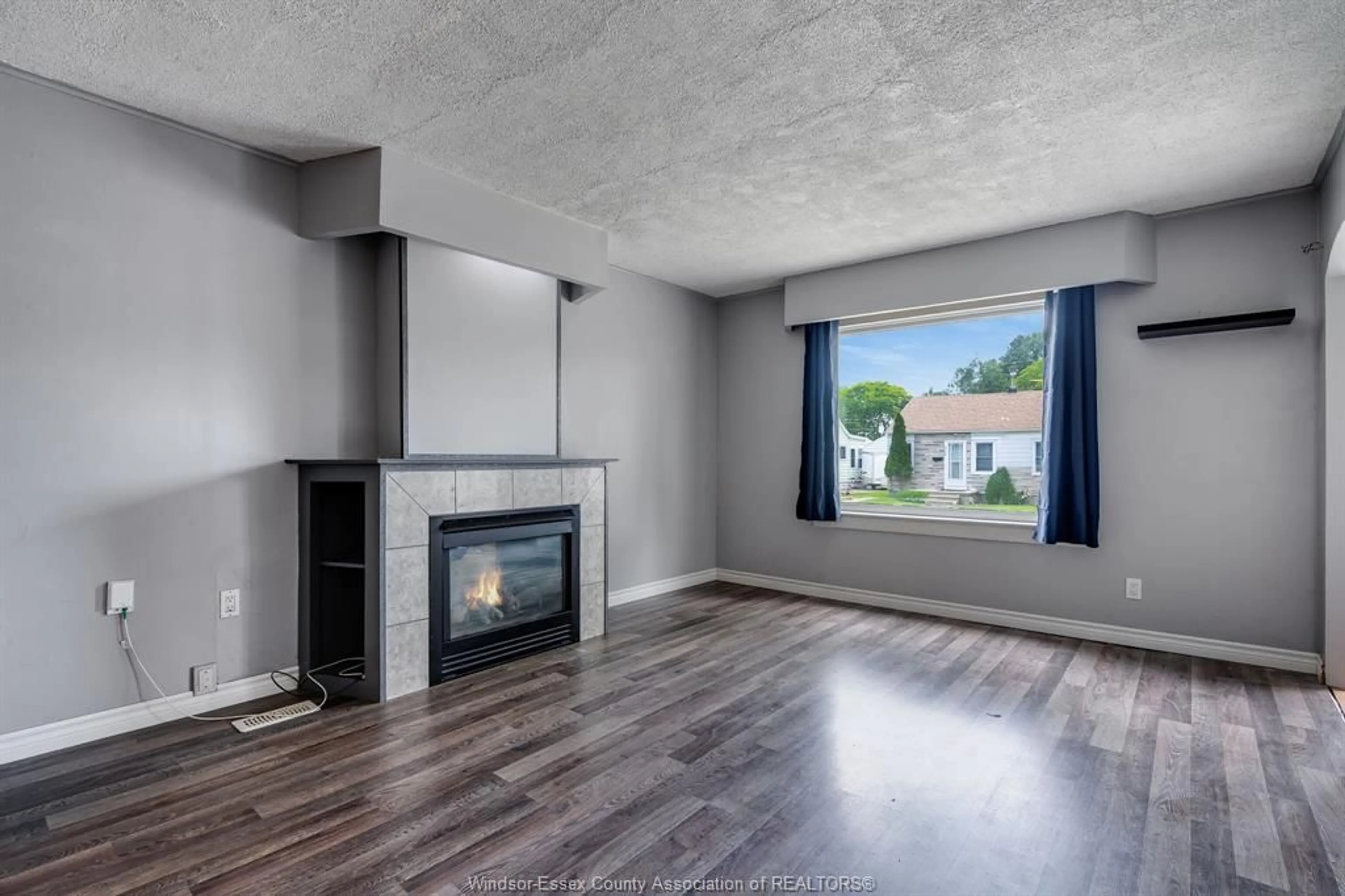 Living room with furniture, wood/laminate floor for 3793 Vaughan, Windsor Ontario N9C 1Z6