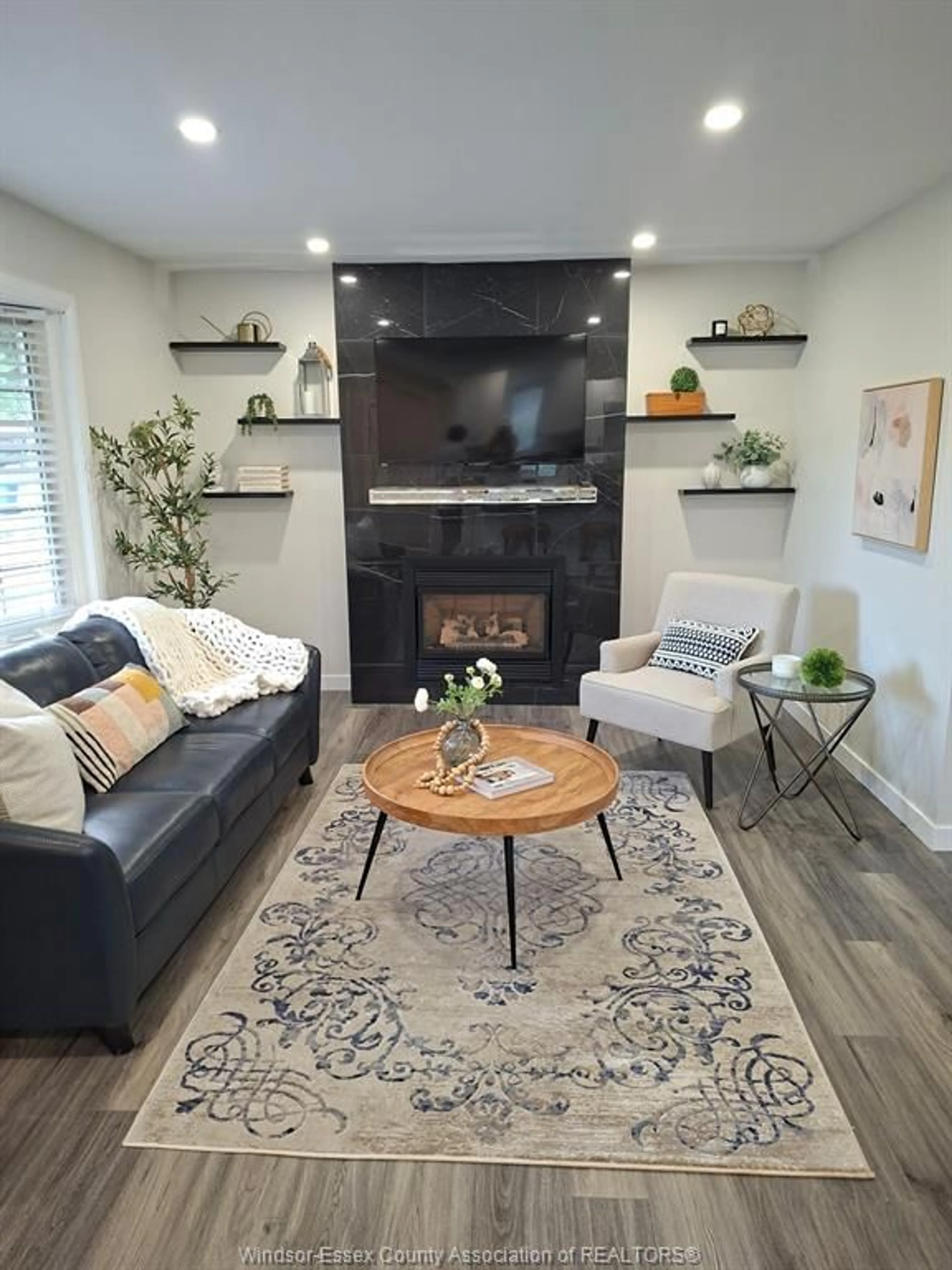 Living room with furniture, wood/laminate floor for 994 EDWARD Ave, Windsor Ontario N8S 2Z8