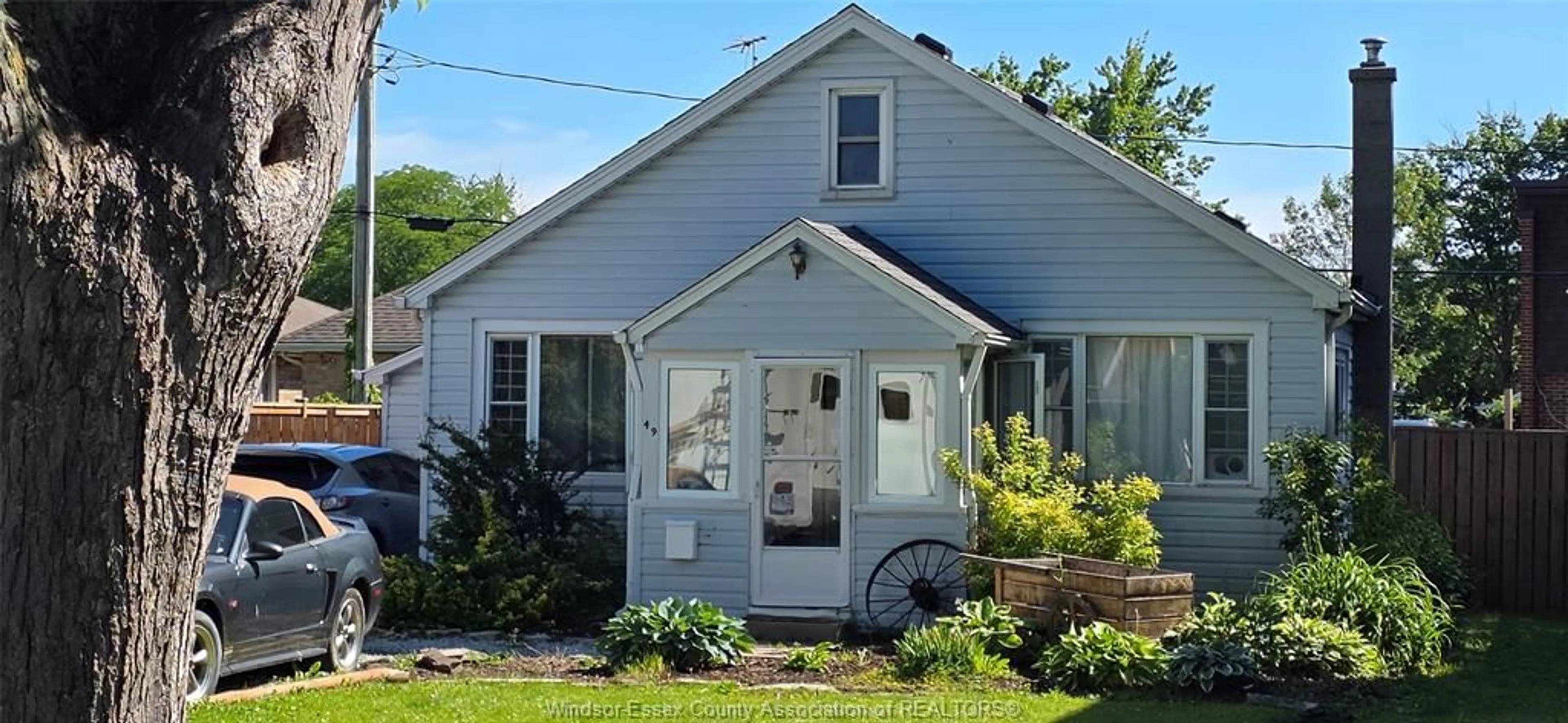 Home with vinyl exterior material, street for 49 MAPLE Row, Essex Ontario N8M 2T8