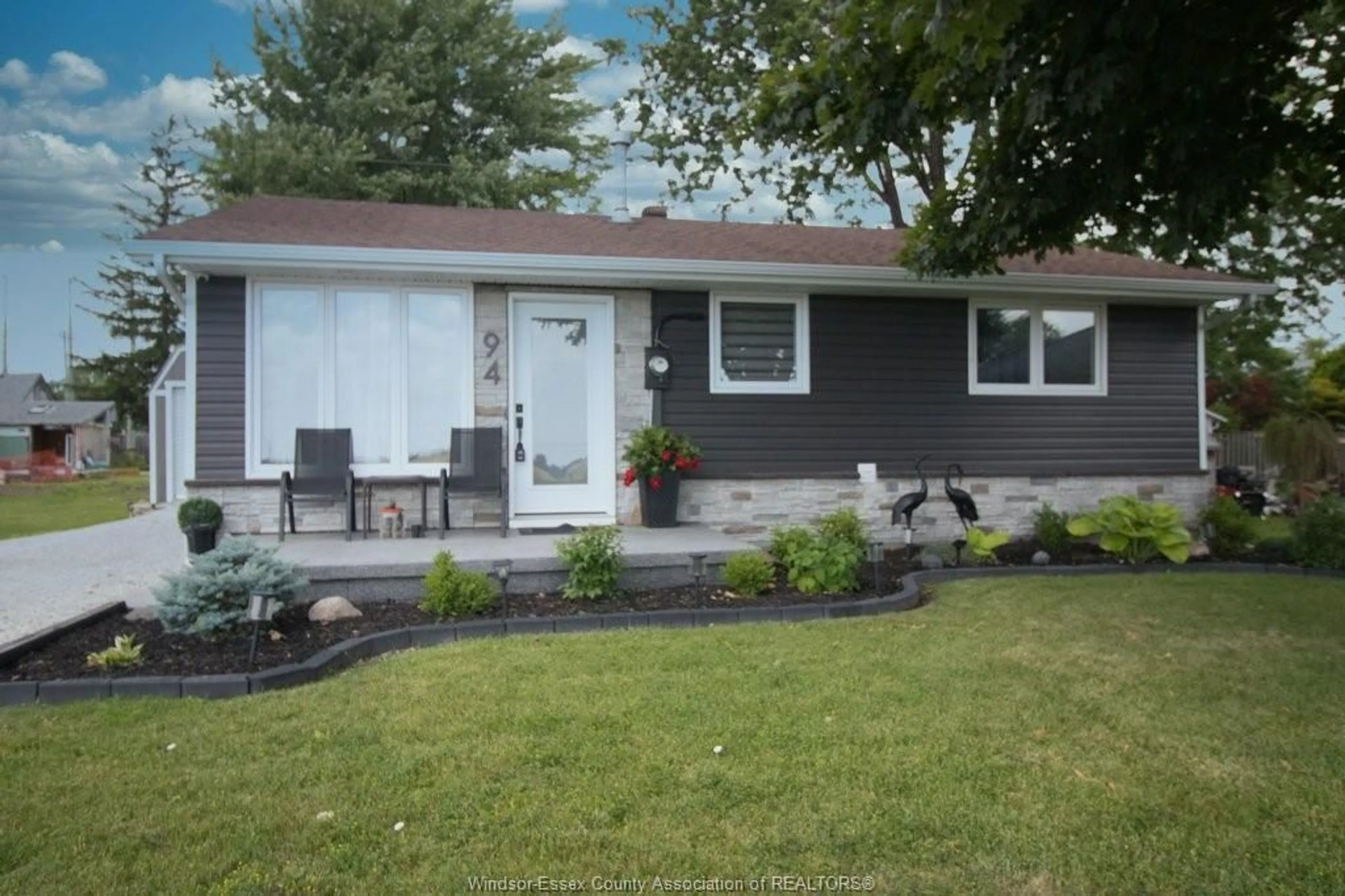 Home with vinyl exterior material, street for 94 Canal, Tilbury Ontario N0P 2L0