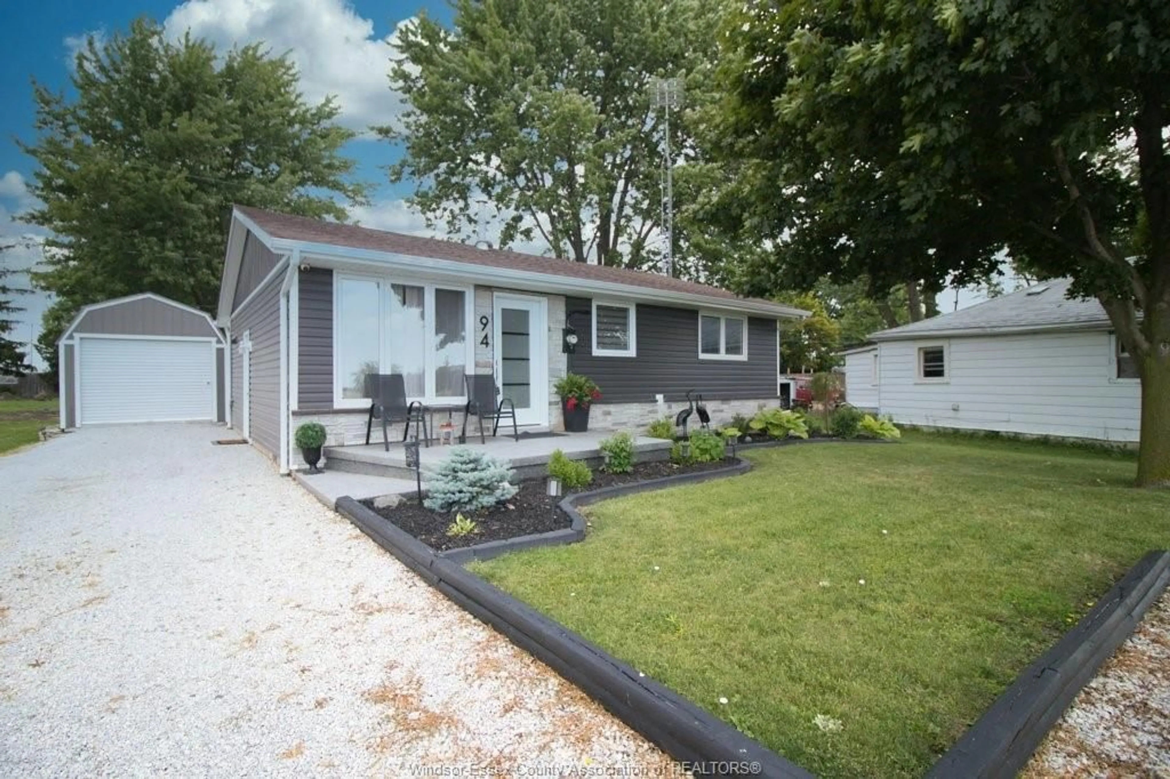 Home with vinyl exterior material, street for 94 Canal, Tilbury Ontario N0P 2L0
