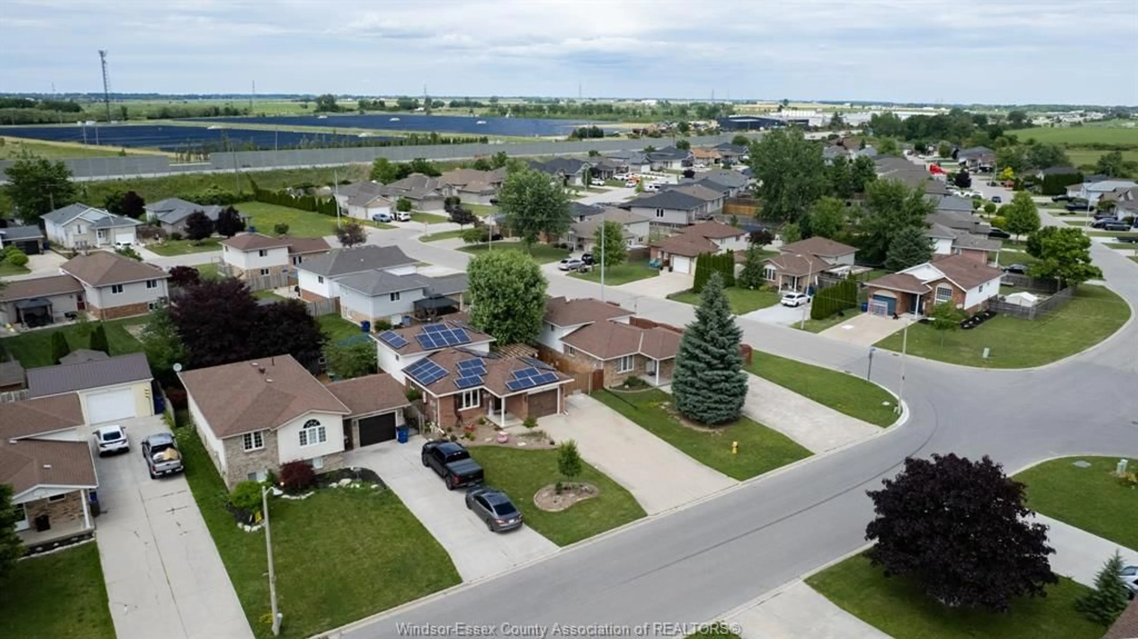 A pic from outside/outdoor area/front of a property/back of a property/a pic from drone, water/lake/river/ocean view for 18 AZAR Dr, Tilbury Ontario N0P 2L0
