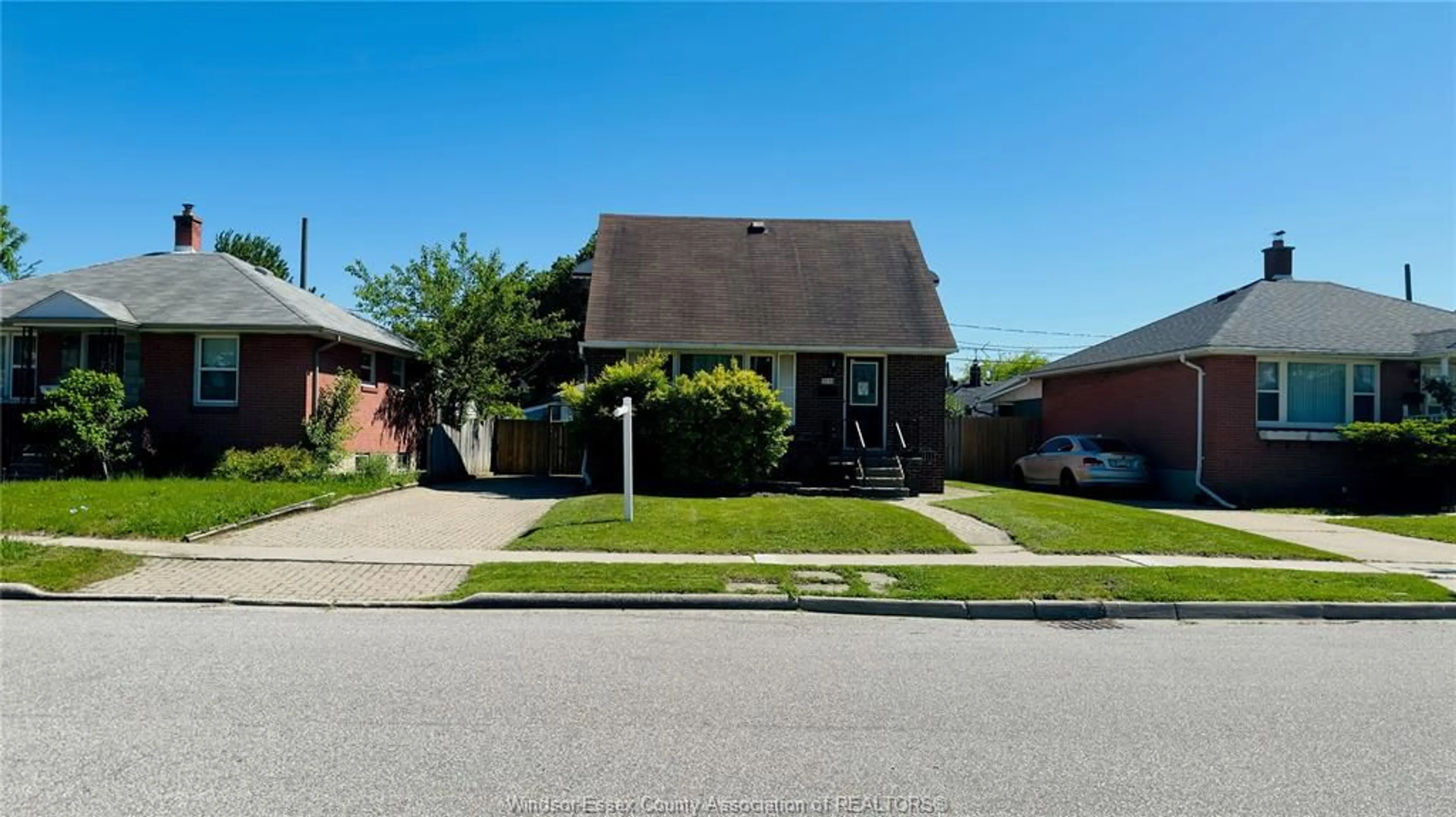 Home with brick exterior material, street for 3519 TECUMSEH Rd, Windsor Ontario N9C 2B6