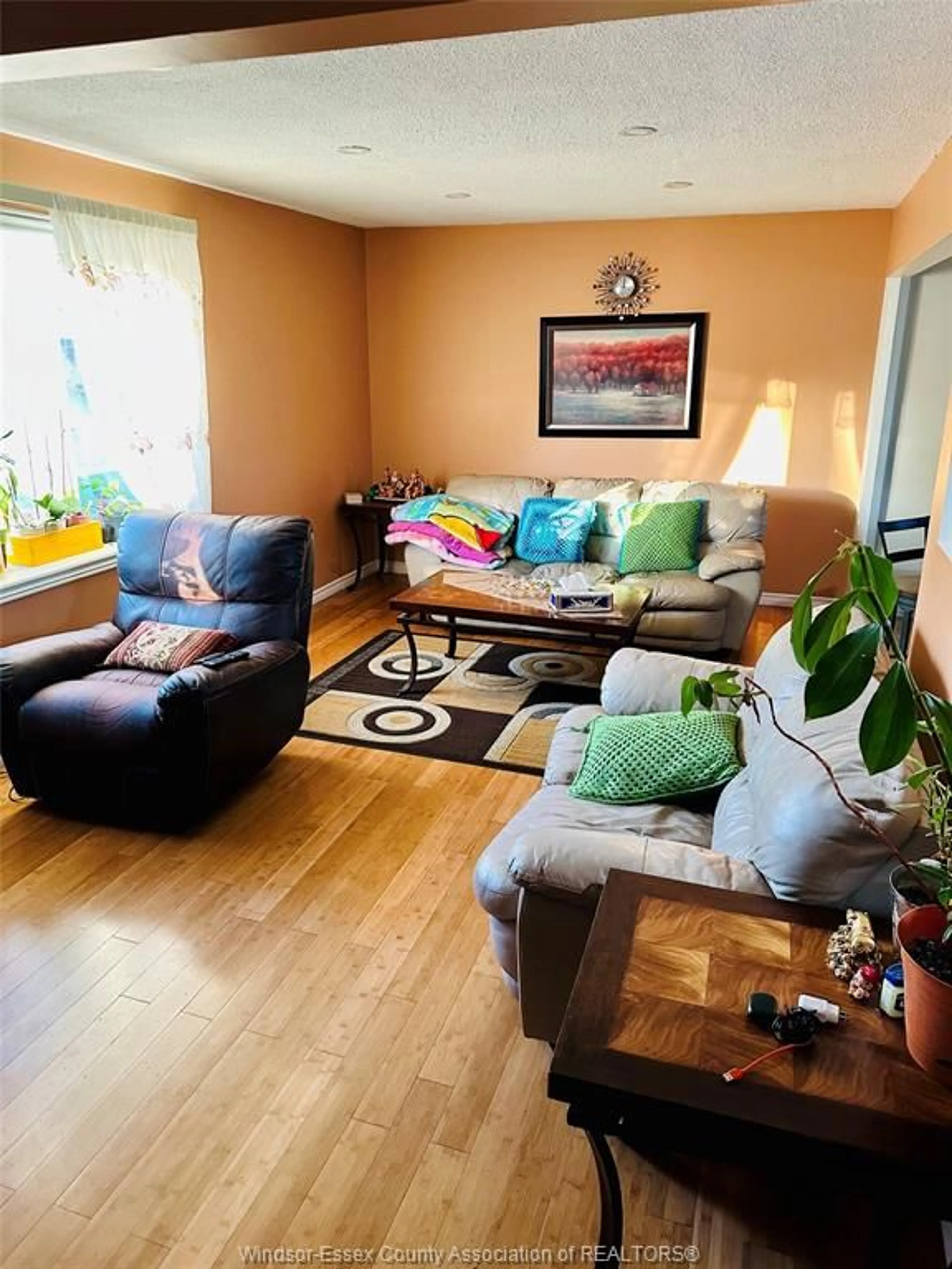 Living room with furniture, wood/laminate floor for 5835 ROSE St, Windsor Ontario N8T 3E6