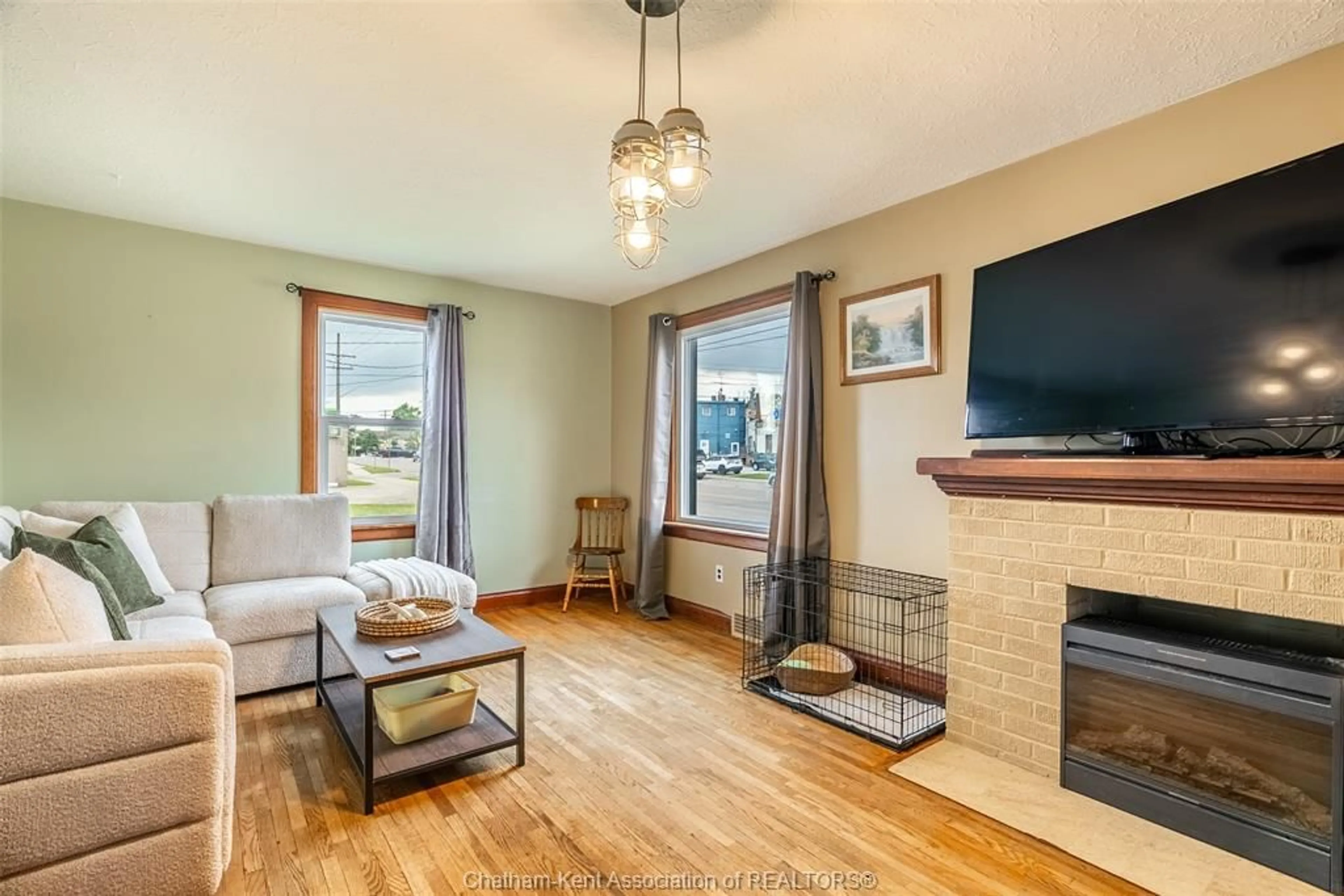 Living room with furniture, wood/laminate floor for 30 Marlborough St, Blenheim Ontario N0P 1A0
